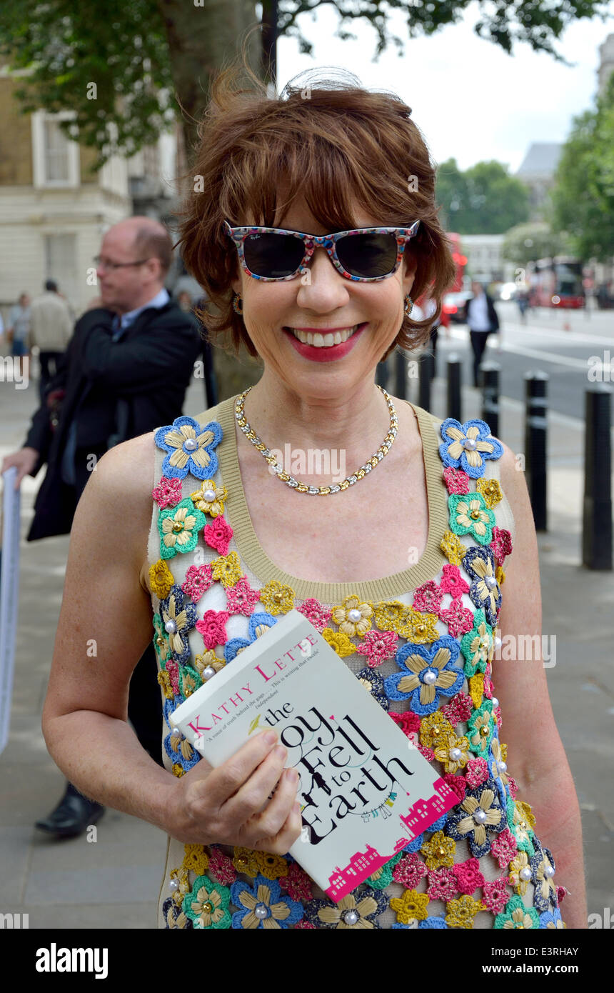 Australian author Kathy Lette with her book The Boy who Fell to Earth Stock Photo