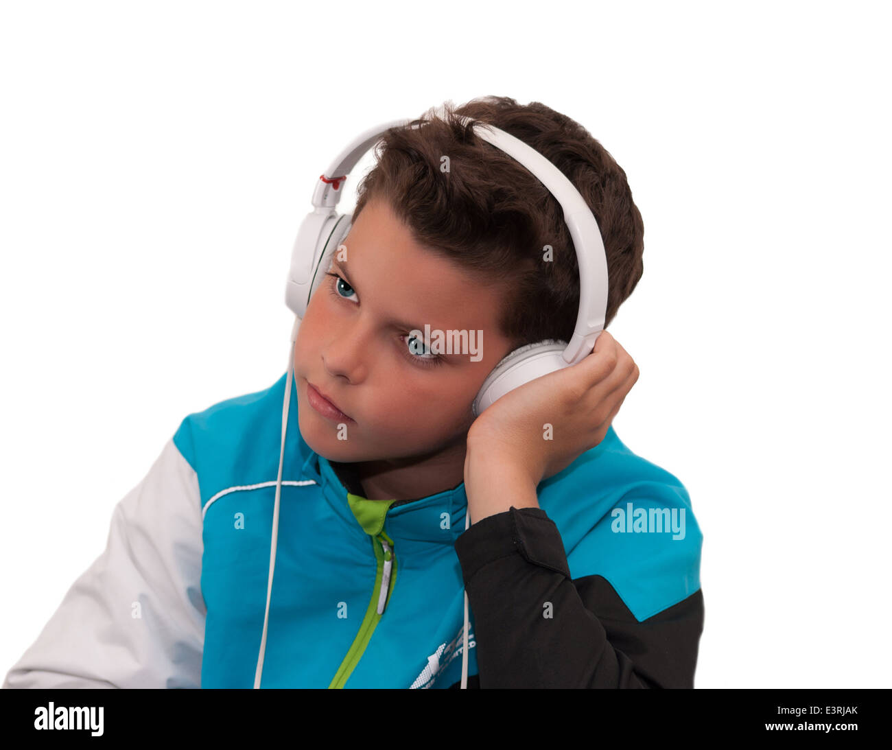 Blue eyes young boy with headphones on white background Stock Photo