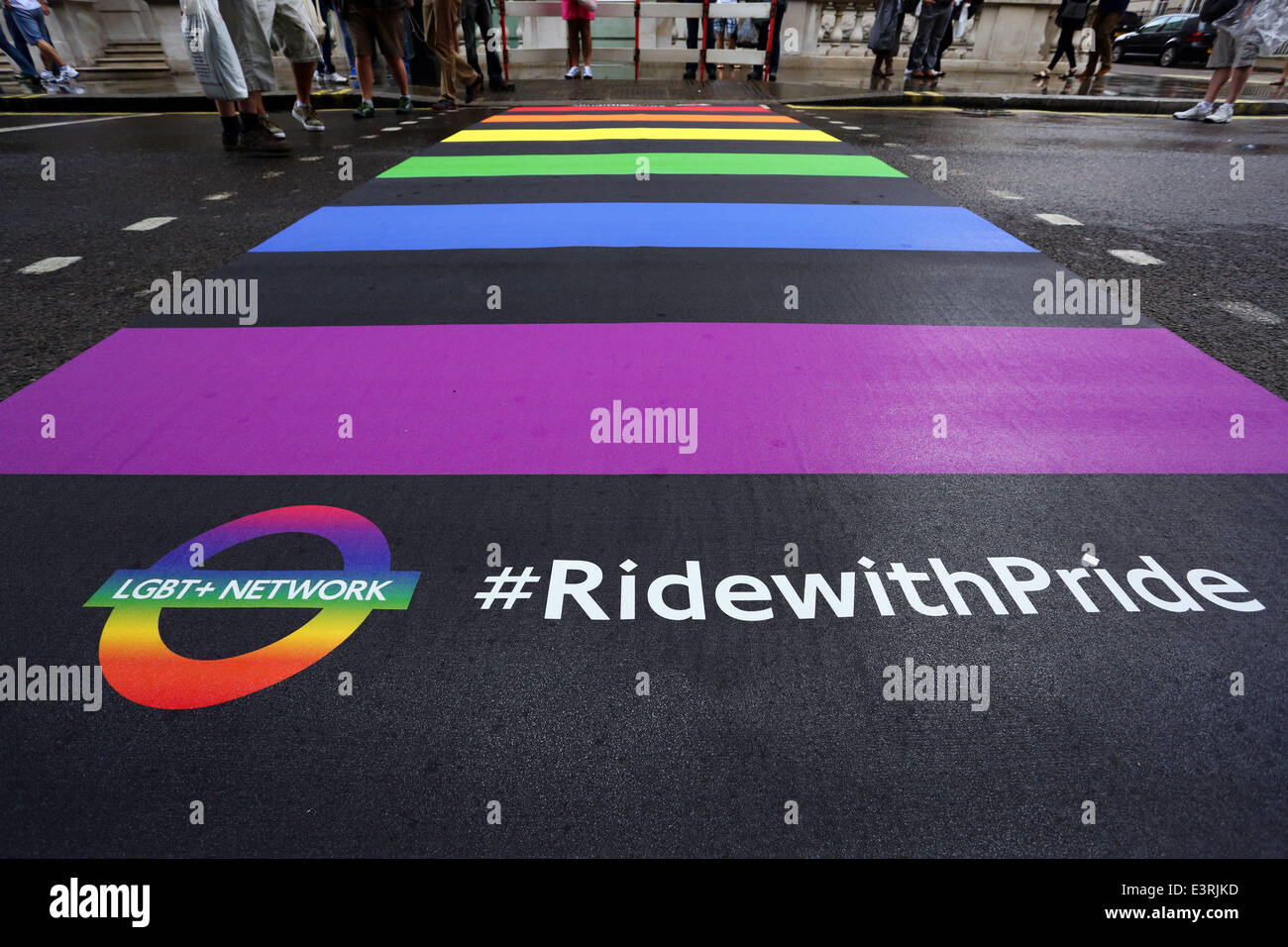 London, UK. 28th June, 2014. London's first Rainbow Crossing unveiled at Pride London 2014 on Pall Mall East. The pedestrian crossing symbolises the colours of the Gay Pride flag and the LGBT community. Credit:  Paul Brown/Alamy Live News Stock Photo