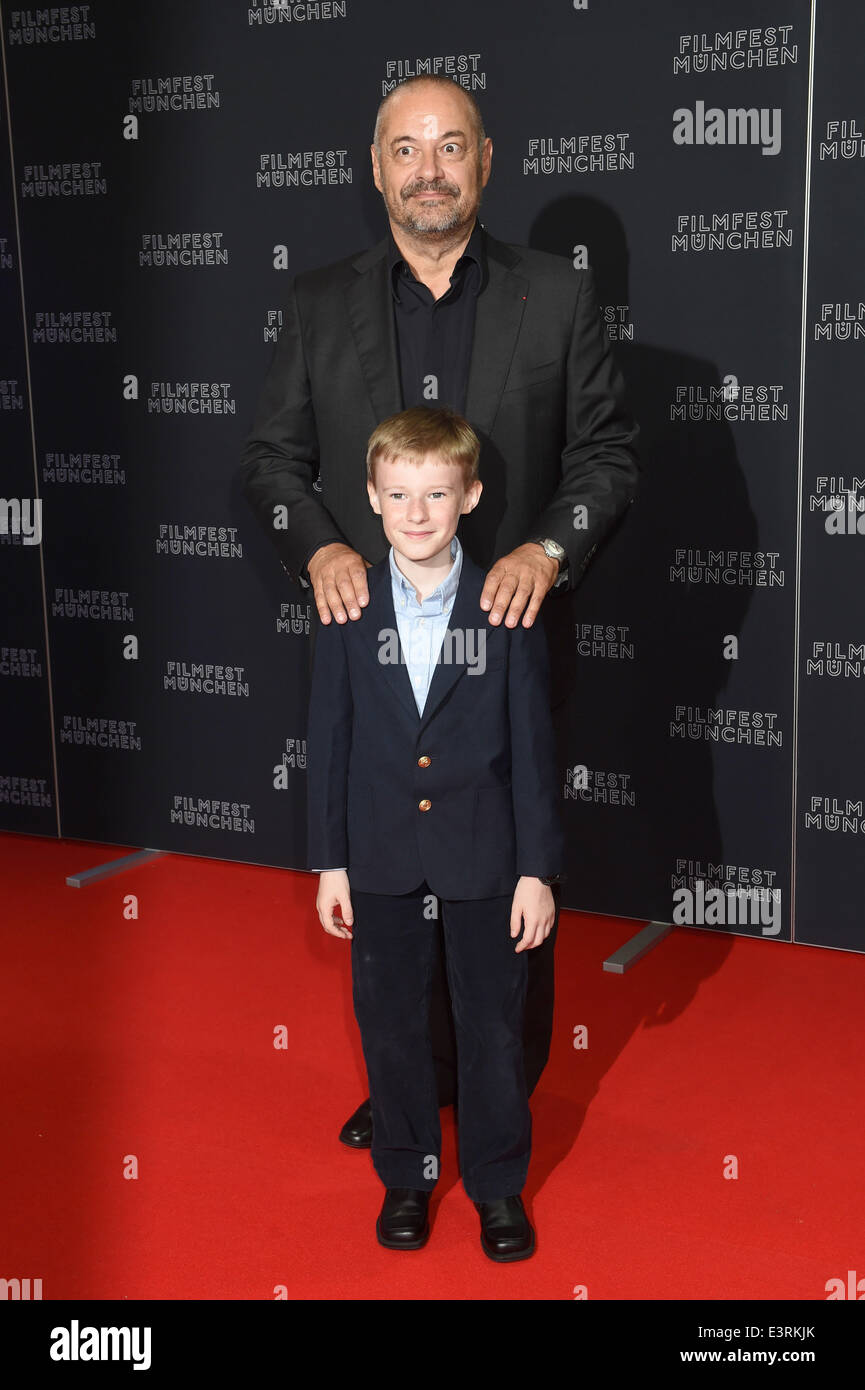 Munich, Germany. 27th June, 2014. The french director Jean-Pierre Jeunet and the young Canadian actor Kyle Catlett, main character of the opening movie 'The Selected Works of T.S. Spivet', pose during the opening of the Munich film festival in Munich, Germany, 27 June 2014. The festival runs from 27 June to 05 July 2014. Photo: Felix Hoerhager/dpa/Alamy Live News Stock Photo