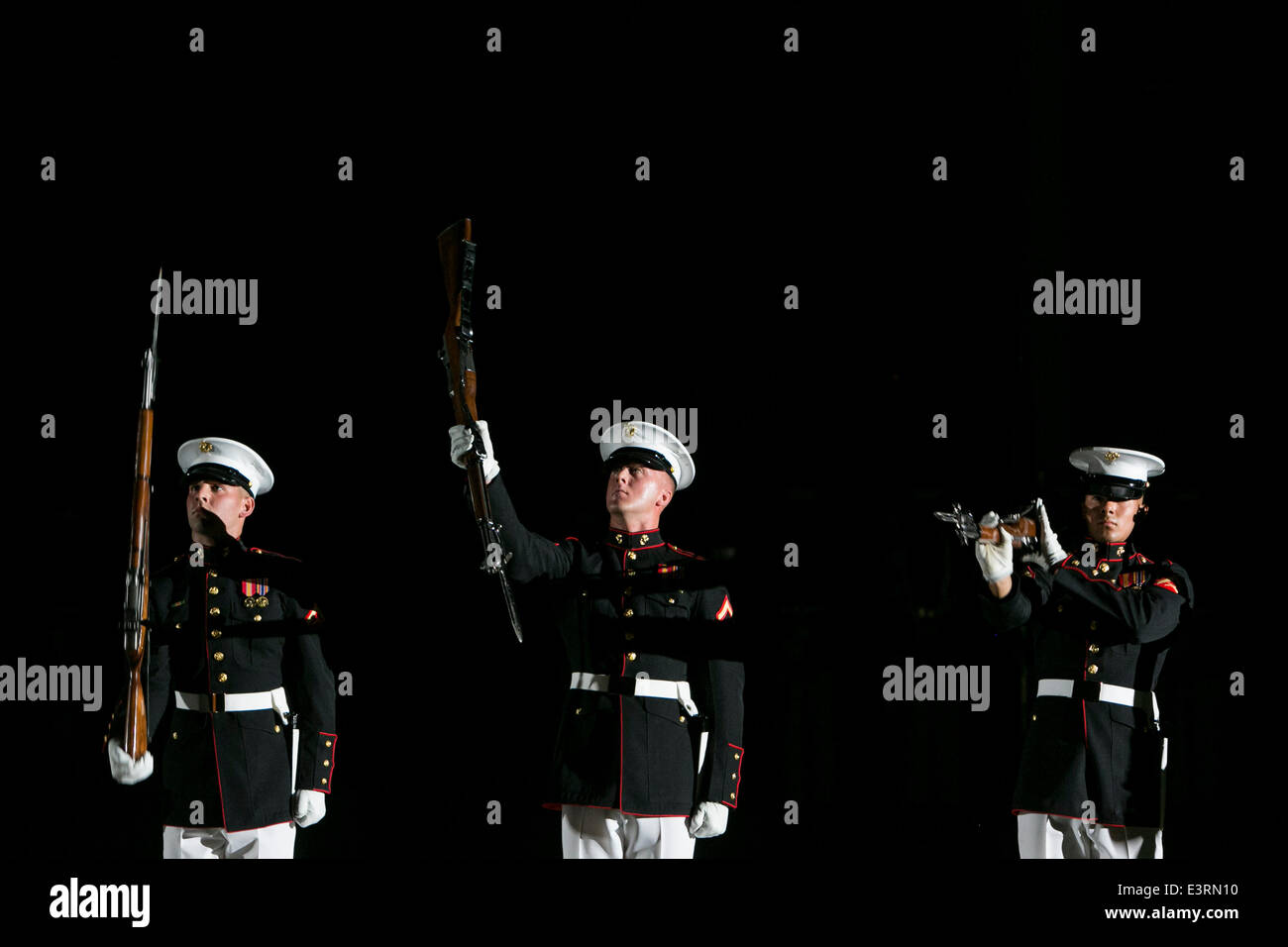 Washington, DC. 27th June, 2014. The Marine Corps Silent Drill Platoon performs during The Marine Barracks Washington, DC Evening Parade in Washington, DC, on Friday, June 27, 2014. Credit: Kristoffer Tripplaar/Pool via CNP/dpa/Alamy Live News Stock Photo