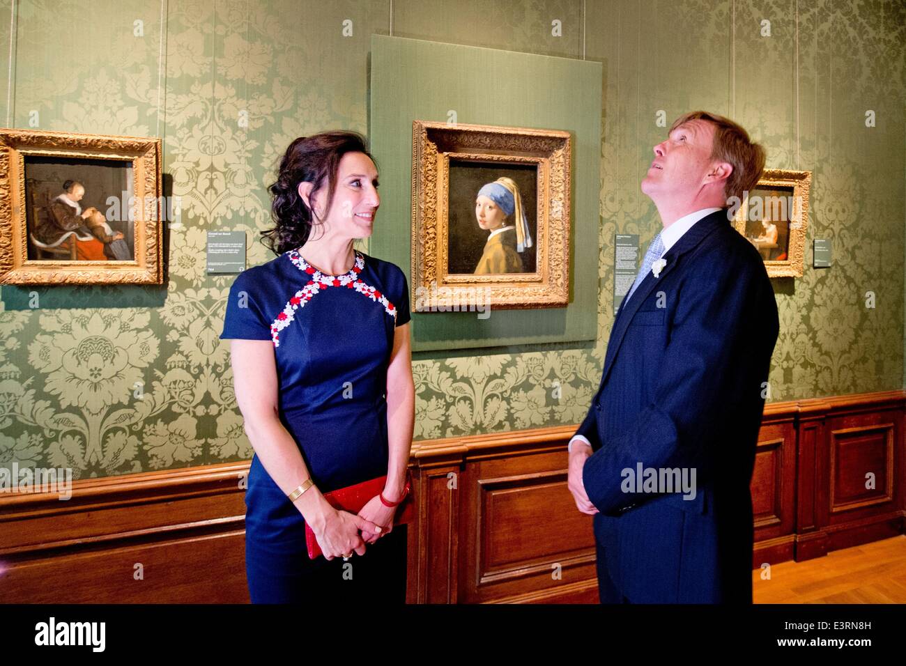 Dutch King Willem-Alexander visits the Mauritshuis museum in The Hague, The Netherlands after the re-opening, 27 June 2014. In the background: the master piece 'Girl with a Pearl Earring' of Johannes Vermeer. The museum has been renovated the last two years and expanded. Photo: Patrick van Katwijk -NO WIRE SERVICE- Stock Photo