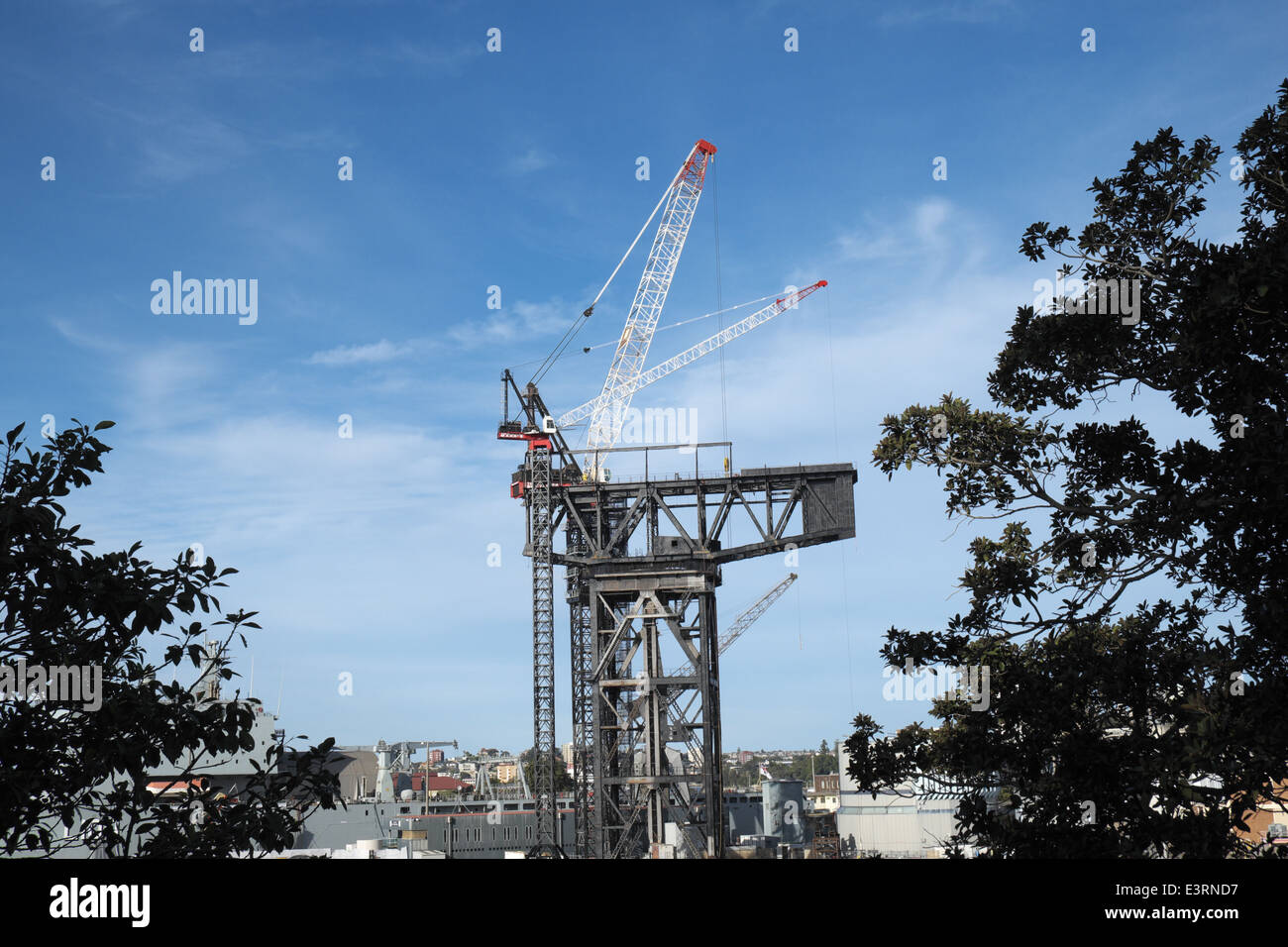 Hammerhead crane now being pulled down, at sydney's garden island naval base,new south wales,australia Stock Photo