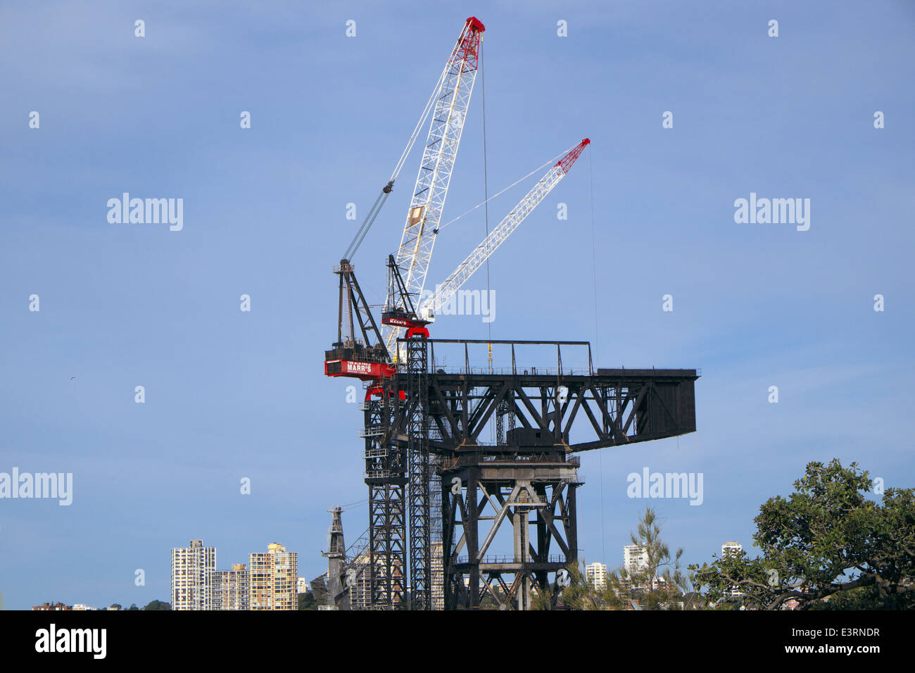 Hammerhead crane now being pulled down, at sydney's garden island naval base,new south wales,australia Stock Photo