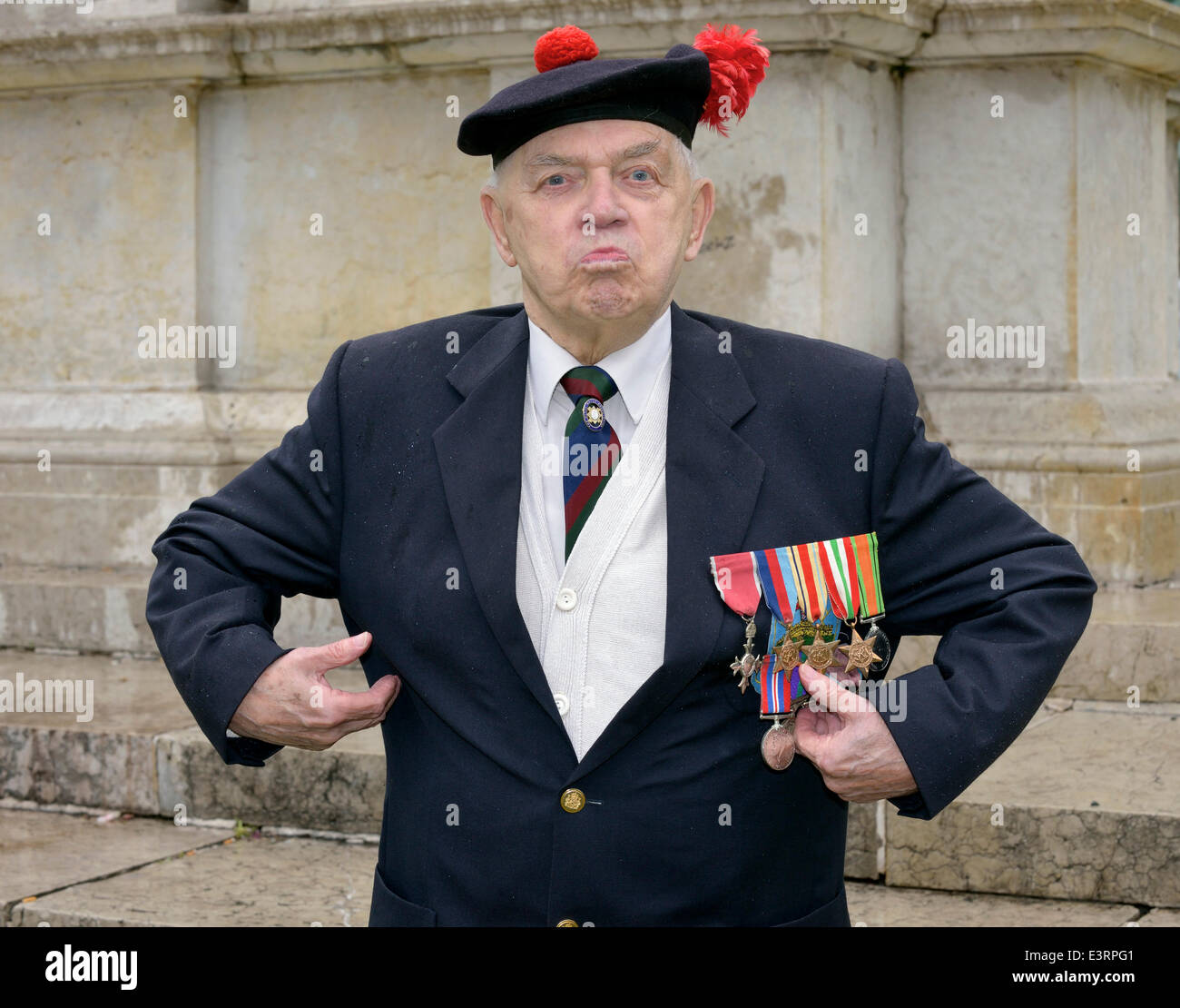 Manchester, UK. 28th June, 2014. 91 year-old John Clarke, a member of the Black Watch Association attends the Manchester Armed Forces Day in Piccadilly Gardens. John, a holder of the MBE and Polish Gold Cross, is possibly the last surviving soldier from the Battle of Monte Cassino in Italy during WW2. Amed Forces Day Manchester, UK Credit:  John Fryer/Alamy Live News Stock Photo