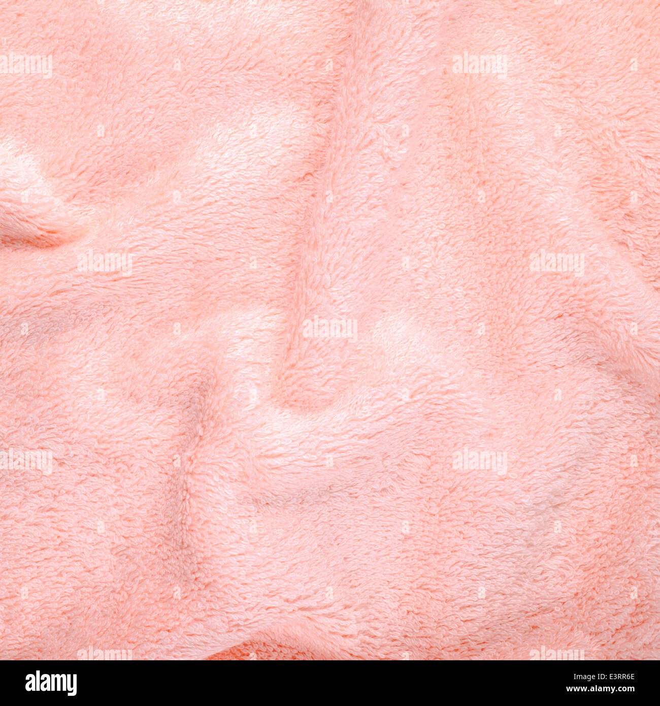 pink texture of bath towel folded as a background Stock Photo