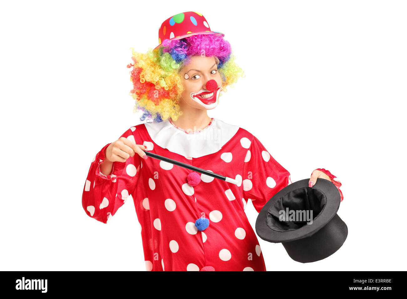 Female clown holding a magician hat Stock Photo