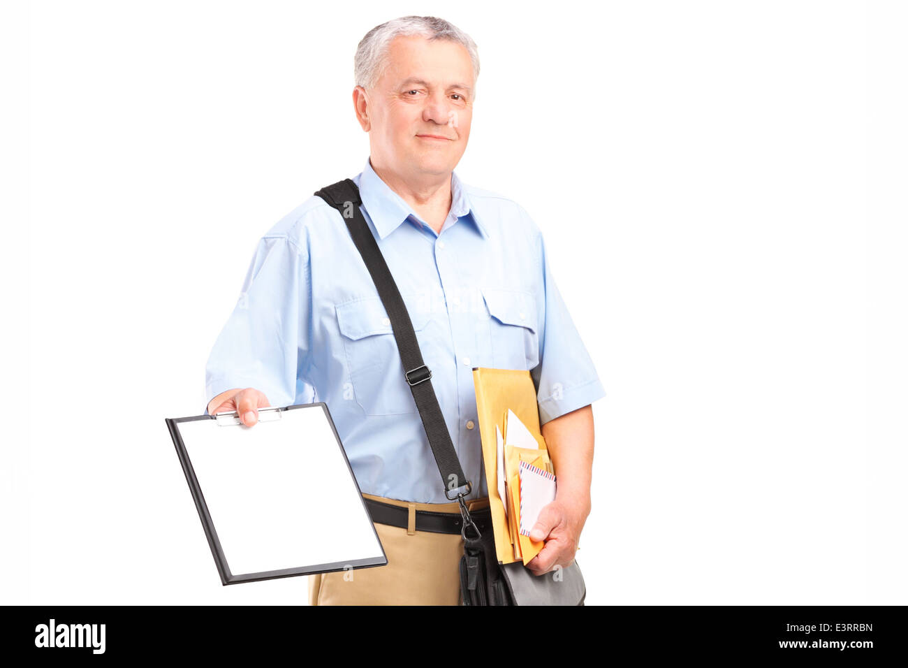 Mailman holding clipboard and bunch of envelopes Stock Photo