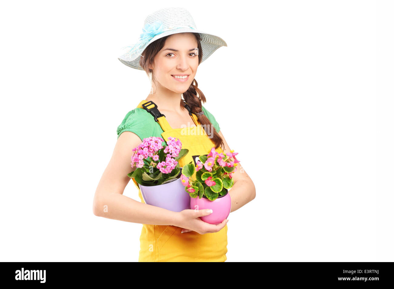 Female gardener holding two flowerpots Stock Photo - Alamy