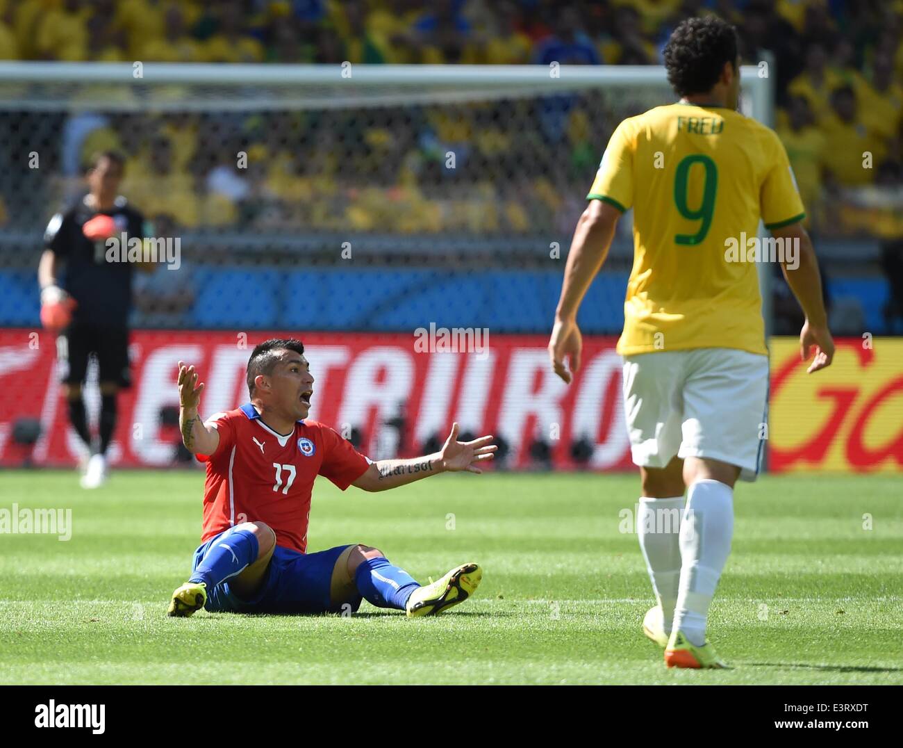 Belo Horizonte, Brazil. 28th June, 2014. Chile's Gary Medel reacts after falling down during a Round of 16 match between Brazil and Chile of 2014 FIFA World Cup at the Estadio Mineirao Stadium in Belo Horizonte, Brazil, on June 28, 2014. Credit:  Liu Dawei/Xinhua/Alamy Live News Stock Photo