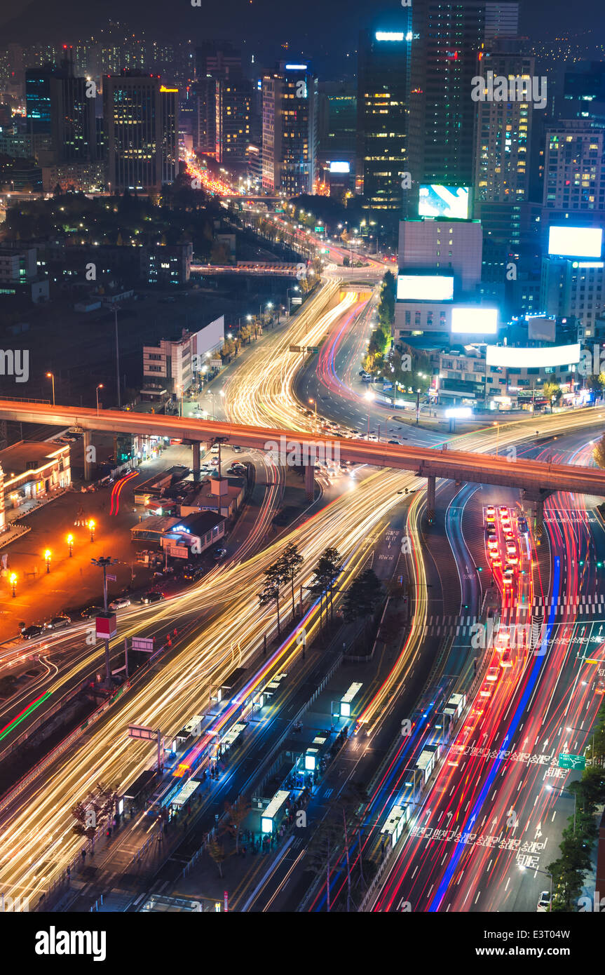 Night traffic blurs past Seoul Station in Seoul, South Korea. Stock Photo