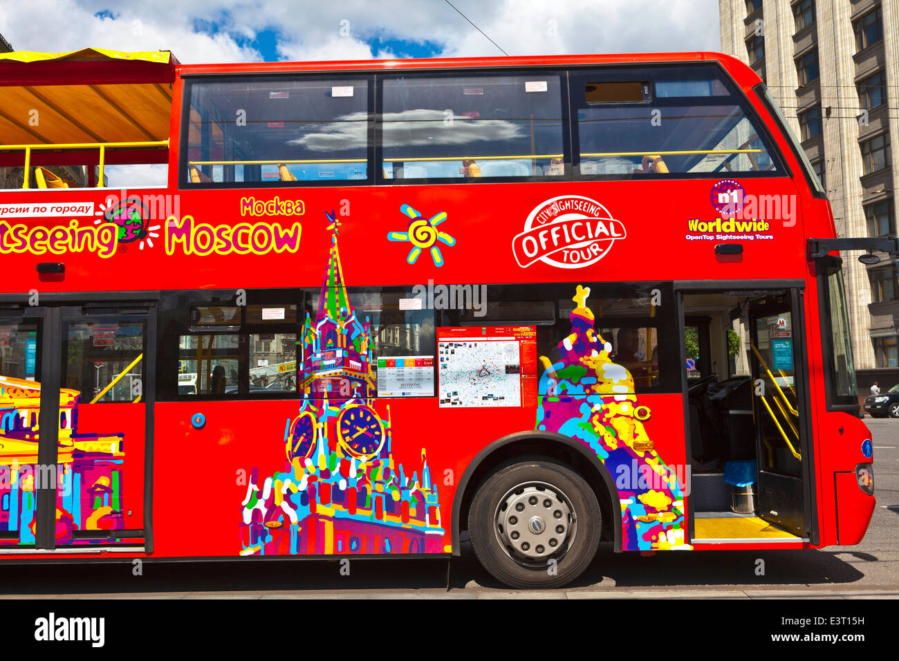 Brightly decorated sightseeing double-decker open top bus in the city ...