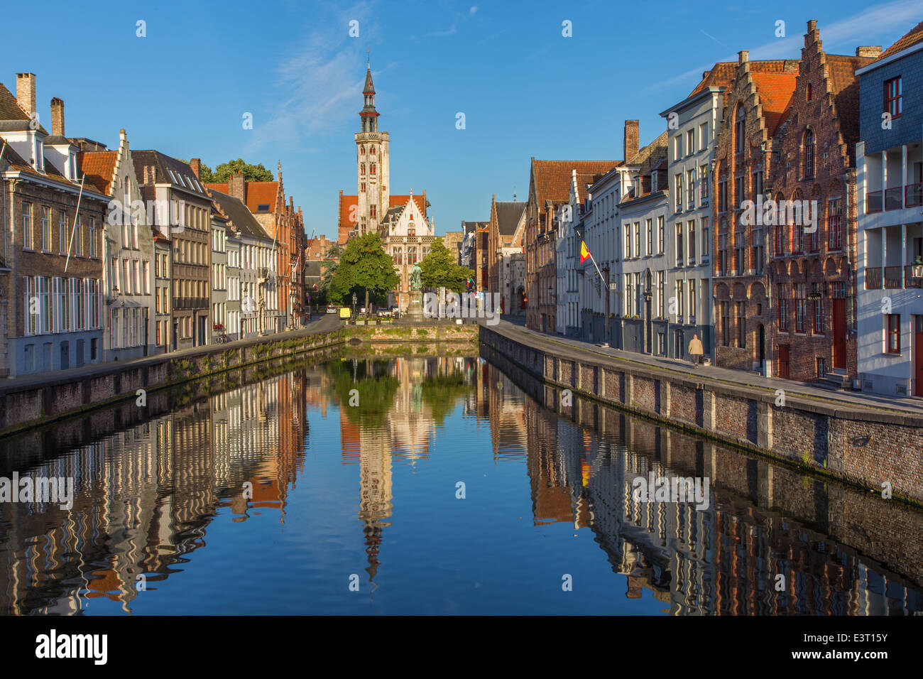 Brugge - Canal and Spigelrei and Spinolarei street with the Burghers lodge building in morning light. Stock Photo