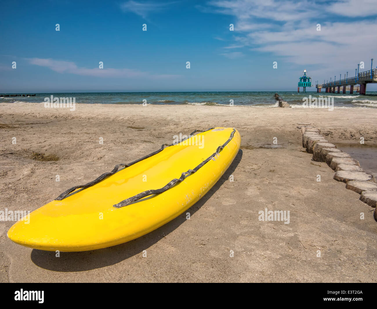 Yellow surfboard on the beach Stock Photo Alamy