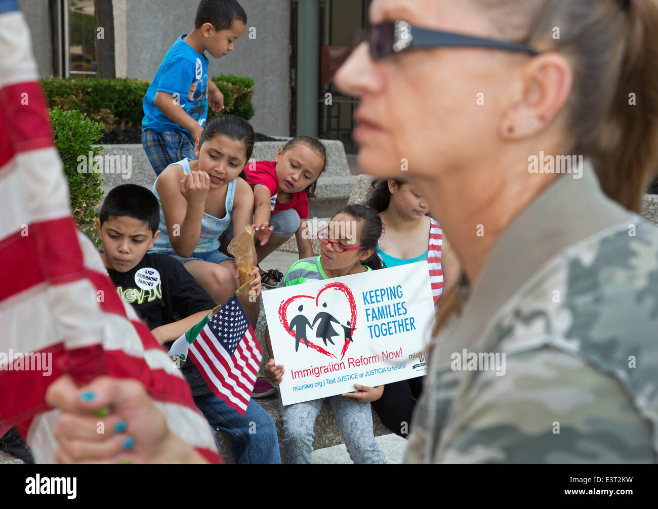 Detroit, Michigan, USA. Immigrant rights activists rally at the Federal Building, calling on President Obama to end deportations and the separation of families. Credit:  Jim West/Alamy Live News Stock Photo