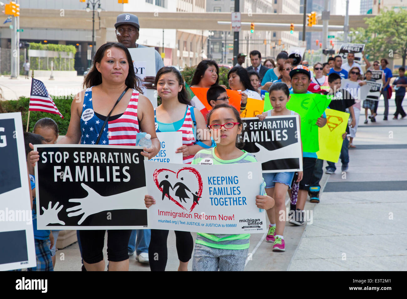 Detroit, Michigan, USA. Immigrant rights activists rally at the Federal Building, calling on President Obama to end deportations and the separation of families. Credit:  Jim West/Alamy Live News Stock Photo