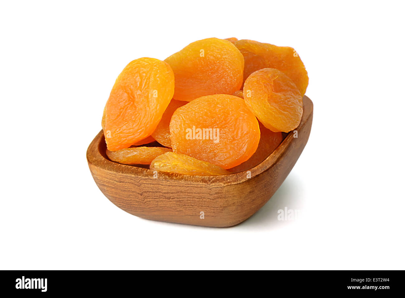 Bowl with dried apricots isolated on white background Stock Photo