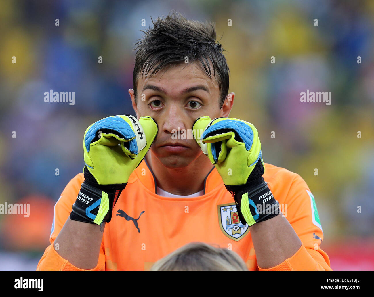 Rio De Janeiro, Brazil. 28th June, 2014. World Cup 2nd Round. Colombia versus Uruguay. Nestor Fernando Muslera checks his contact lens before kick-off Credit:  Action Plus Sports/Alamy Live News Stock Photo