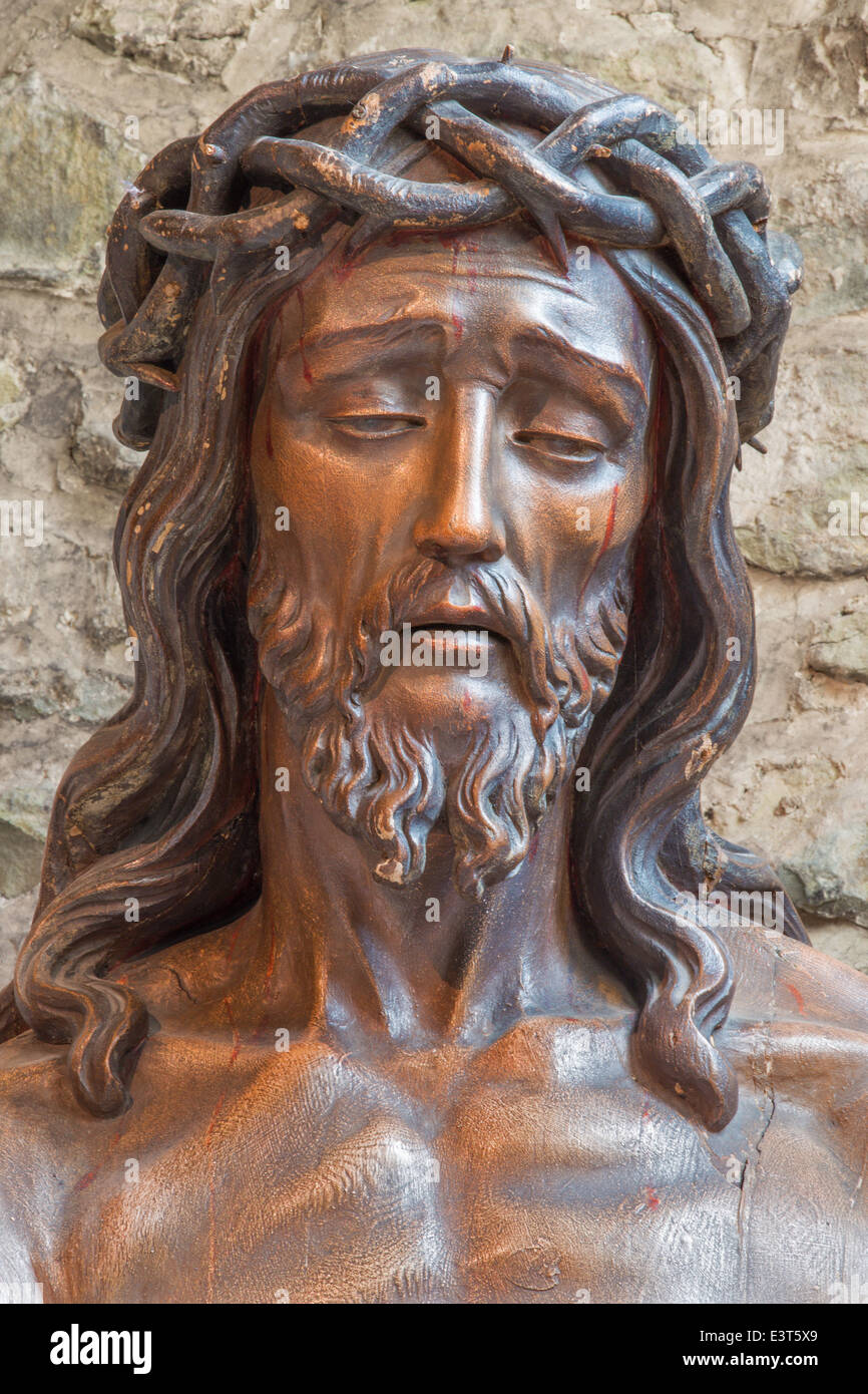 BRUGGE, BELGIUM - JUNE 13, 2014: Statue of Jesus in the bond in Basilica of the Holy bold. Stock Photo