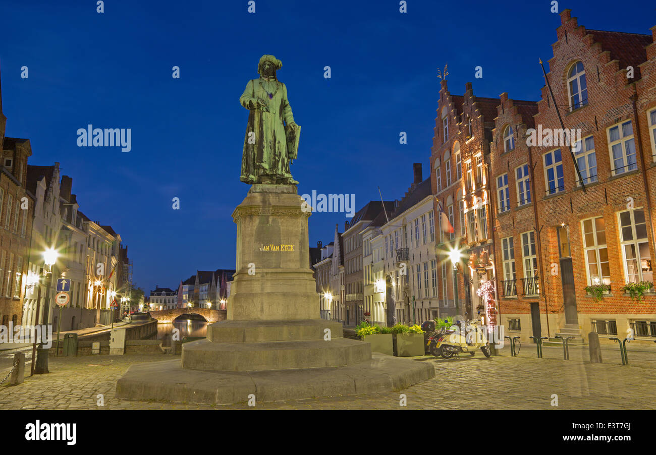 BRUGGE, BELGIUM - JUNE 13, 2014: Jan van Eyck memorial by Jan Calloigne (1856) in evening dusk. Stock Photo