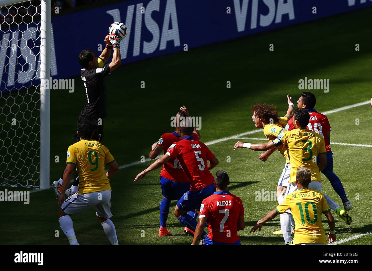 Belo Horizonte, Brazil. 28th June, 2014. Chile's goalkeeper Jorge Sampaoli (L, up) plucks the ball during a Round of 16 match between Brazil and Chile of 2014 FIFA World Cup at the Estadio Mineirao Stadium in Belo Horizonte, Brazil, on June 28, 2014. Credit:  Liu Bin/Xinhua/Alamy Live News Stock Photo