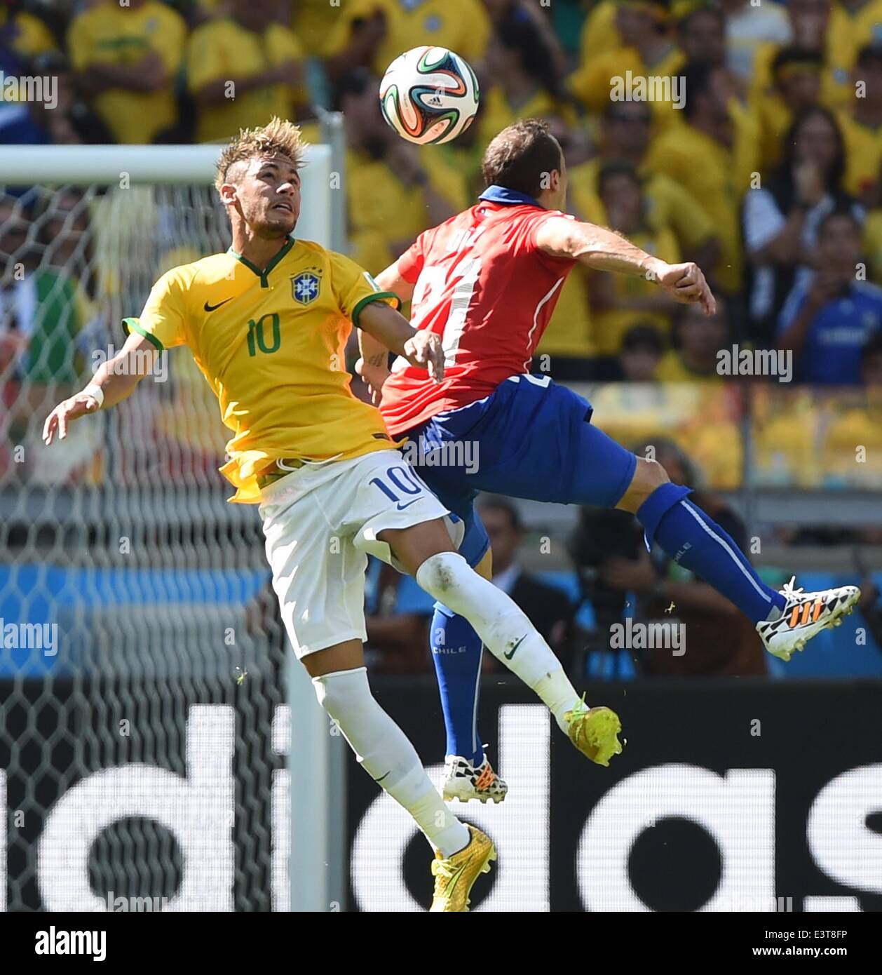 Belo Horizonte, Brazil. 28th June, 2014. Brazil's Neymar competes for a header with Chile's Marcelo Diaz during a Round of 16 match between Brazil and Chile of 2014 FIFA World Cup at the Estadio Mineirao Stadium in Belo Horizonte, Brazil, on June 28, 2014. Credit:  Liu Dawei/Xinhua/Alamy Live News Stock Photo