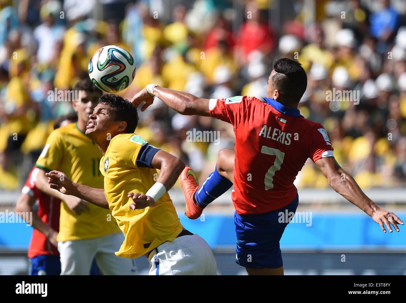 Belo Horizonte, Brazil. 28th June, 2014. Brazil's Thiago Silva vies with Chile's Alexis Sanchez during a Round of 16 match between Brazil and Chile of 2014 FIFA World Cup at the Estadio Mineirao Stadium in Belo Horizonte, Brazil, on June 28, 2014. Credit:  Liu Dawei/Xinhua/Alamy Live News Stock Photo