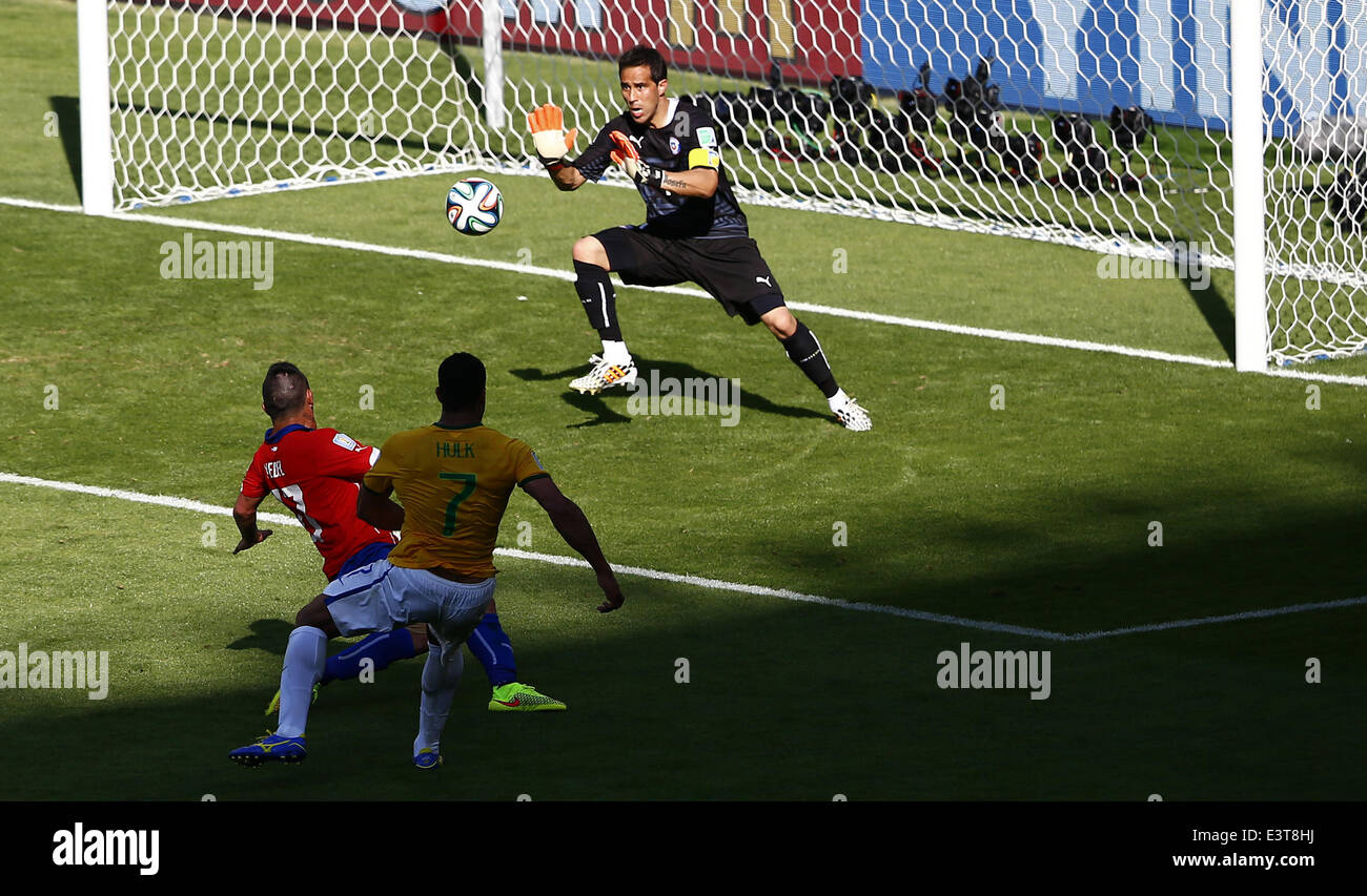 Belo Horizonte, Brazil. 28th June, 2014. Chile's goalkeeper Claudio Bravo (back) attempts to block a shot during a Round of 16 match between Brazil and Chile of 2014 FIFA World Cup at the Estadio Mineirao Stadium in Belo Horizonte, Brazil, on June 28, 2014. Credit:  Liu Bin/Xinhua/Alamy Live News Stock Photo