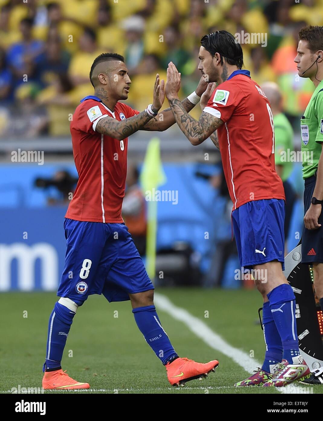Belo Horizonte, Brazil. 28th June, 2014. Chile's Mauricio Pinilla (R) replaces Arturo Vidal during a Round of 16 match between Brazil and Chile of 2014 FIFA World Cup at the Estadio Mineirao Stadium in Belo Horizonte, Brazil, on June 28, 2014. Credit:  Qi Heng/Xinhua/Alamy Live News Stock Photo