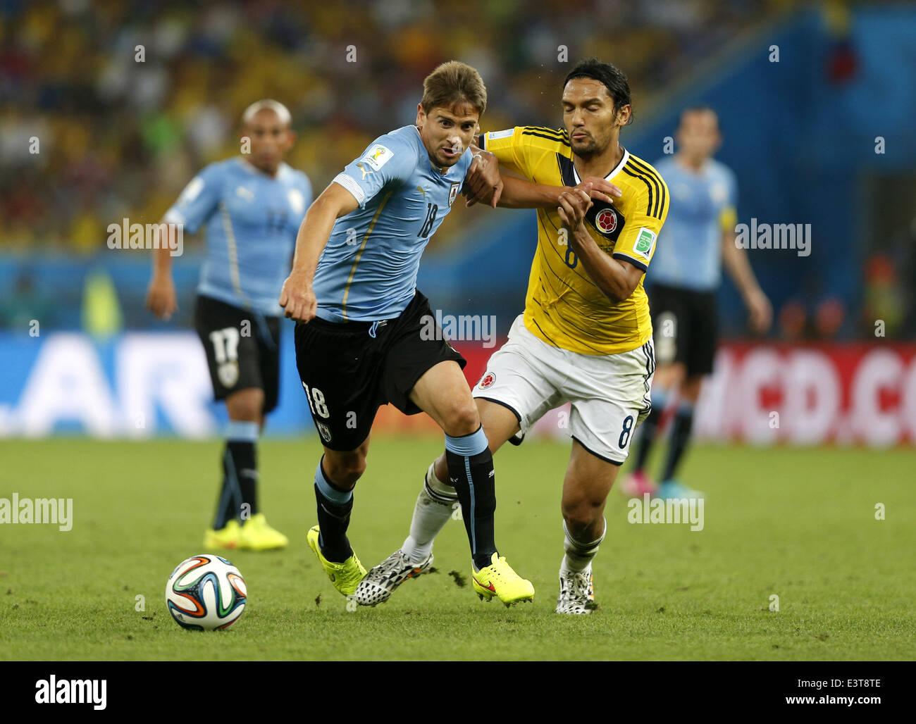 Rio De Janeiro, Brazil. 28th June, 2014. Uruguay's Gaston Ramirez (L, front) vies with Colombia's Abel Aguilar during a Round of 16 match between Colombia and Uruguay of 2014 FIFA World Cup at the Estadio do Maracana Stadium in Rio de Janeiro, Brazil, on June 28, 2014. Credit:  Wang Lili/Xinhua/Alamy Live News Stock Photo