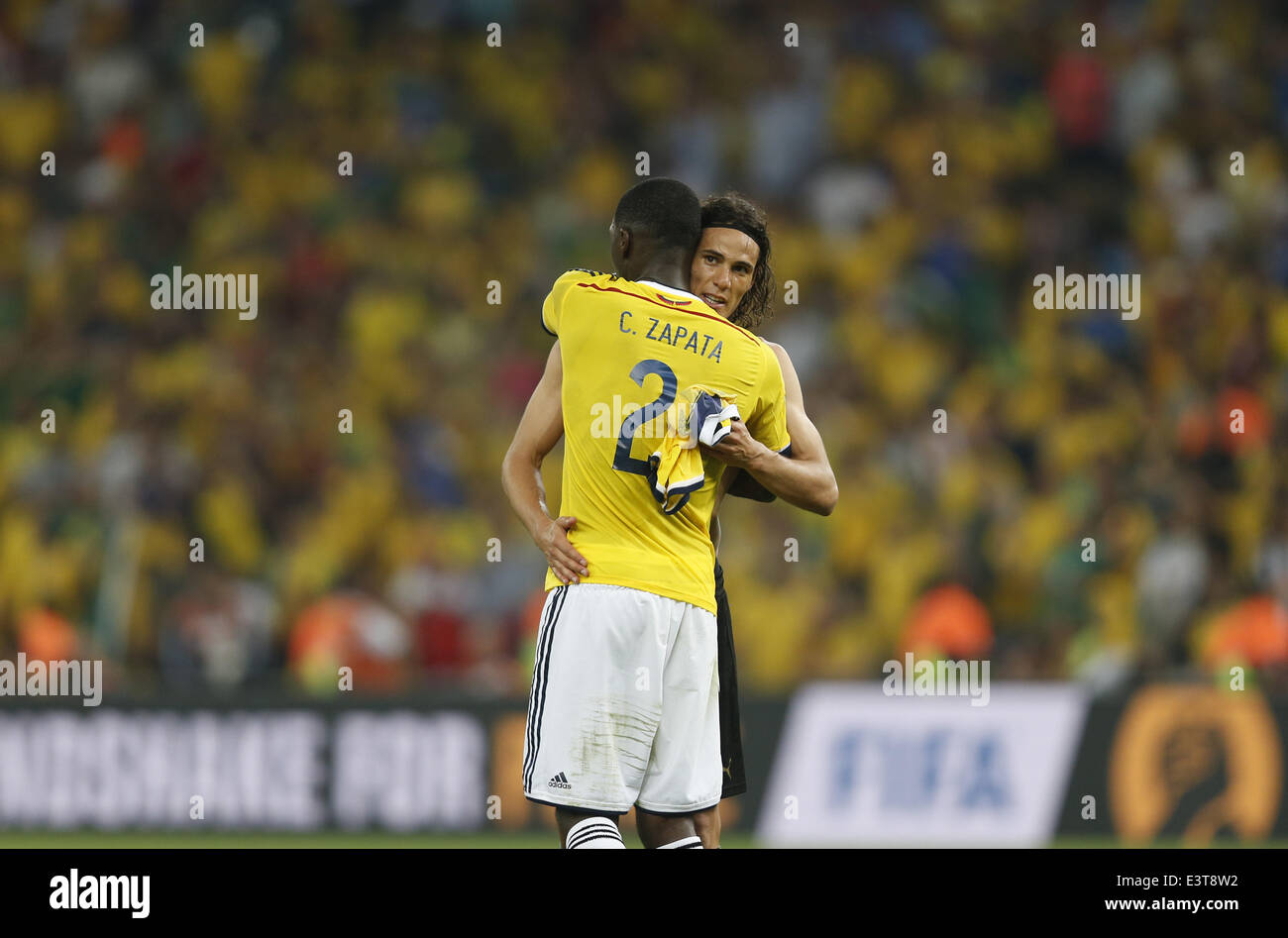 Rio De Janeiro, Brazil. 28th June, 2014. Colombia's Cristian Zapata (front) comforts Uruguay's Edinson Cavani after a Round of 16 match between Colombia and Uruguay of 2014 FIFA World Cup at the Estadio do Maracana Stadium in Rio de Janeiro, Brazil, on June 28, 2014. Colombia won 2-0 over Uruguay and qualified for Quarter-finals on Saturday. Credit:  Wang Lili/Xinhua/Alamy Live News Stock Photo