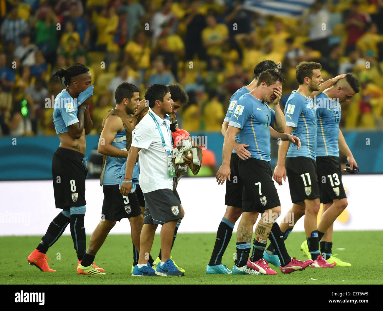 Rio De Janeiro, Brazil. 28th June, 2014. Uruguay's players leave the field after a Round of 16 match between Colombia and Uruguay of 2014 FIFA World Cup at the Estadio do Maracana Stadium in Rio de Janeiro, Brazil, on June 28, 2014. Colombia won 2-0 over Uruguay on Saturday. Credit:  Wang Yuguo/Xinhua/Alamy Live News Stock Photo