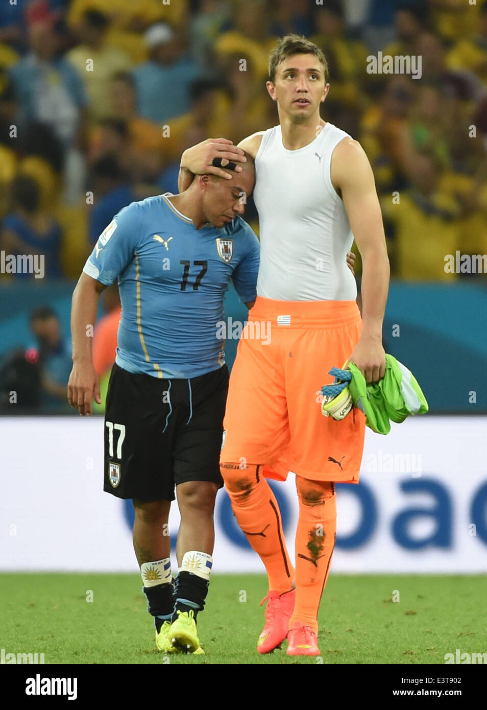 Rio De Janeiro, Brazil. 28th June, 2014. Uruguay's goalkeeper Fernando Muslera (R) hugs Egidio Arevalo Rios after a Round of 16 match between Colombia and Uruguay of 2014 FIFA World Cup at the Estadio do Maracana Stadium in Rio de Janeiro, Brazil, on June 28, 2014. Colombia won 2-0 over Uruguay on Saturday. Credit:  Wang Yuguo/Xinhua/Alamy Live News Stock Photo