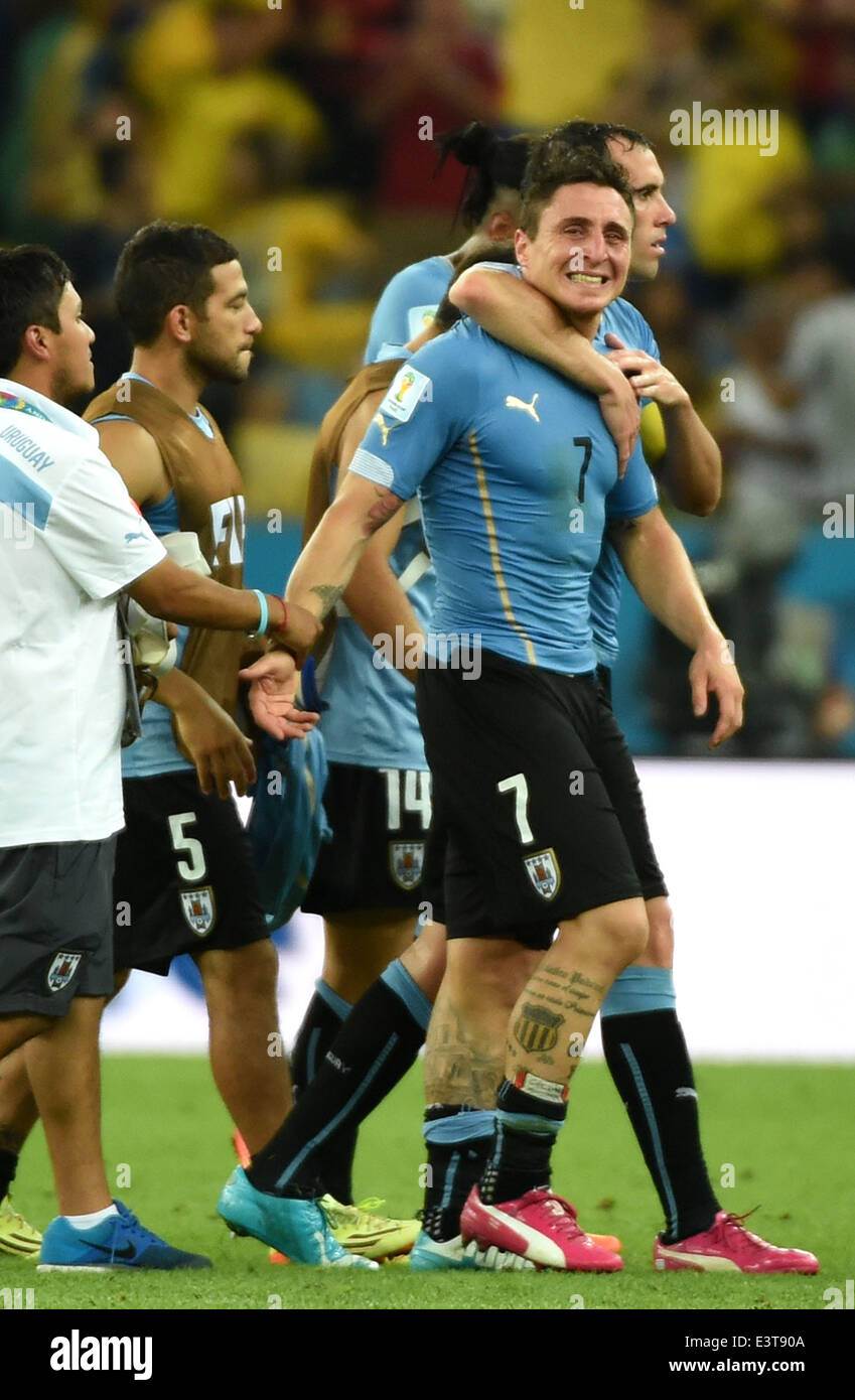 Rio De Janeiro, Brazil. 28th June, 2014. Uruguay's Cristian Rodriguez leaves the field after a Round of 16 match between Colombia and Uruguay of 2014 FIFA World Cup at the Estadio do Maracana Stadium in Rio de Janeiro, Brazil, on June 28, 2014. Colombia won 2-0 over Uruguay on Saturday. Credit:  Wang Yuguo/Xinhua/Alamy Live News Stock Photo