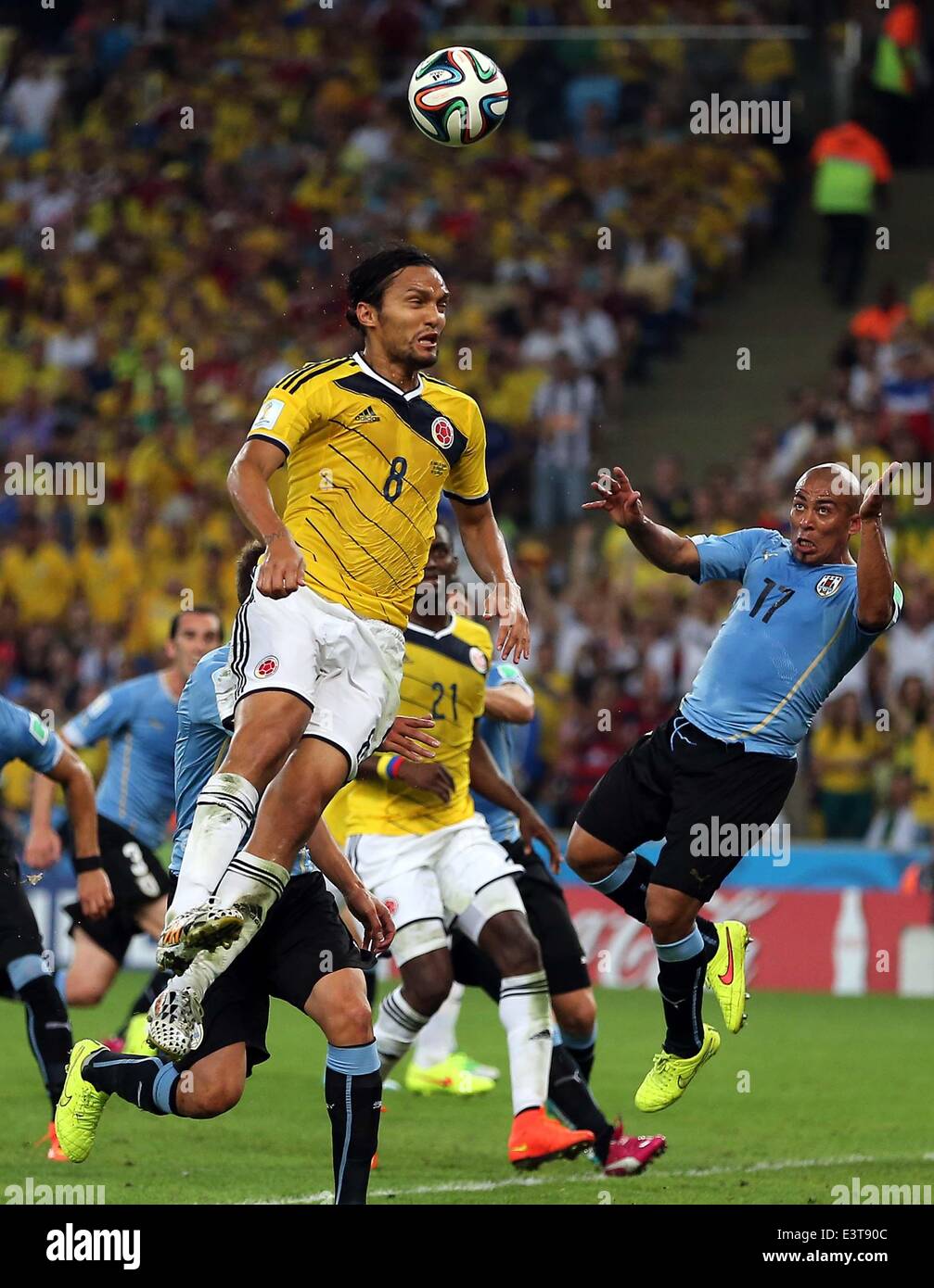 Rio De Janeiro, Brazil. 28th June, 2014. Colombia's Abel Aguilar (up) jumps for a header during a Round of 16 match between Colombia and Uruguay of 2014 FIFA World Cup at the Estadio do Maracana Stadium in Rio de Janeiro, Brazil, on June 28, 2014. Colombia won 2-0 over Uruguay on Saturday. Credit:  Xu Zijian/Xinhua/Alamy Live News Stock Photo