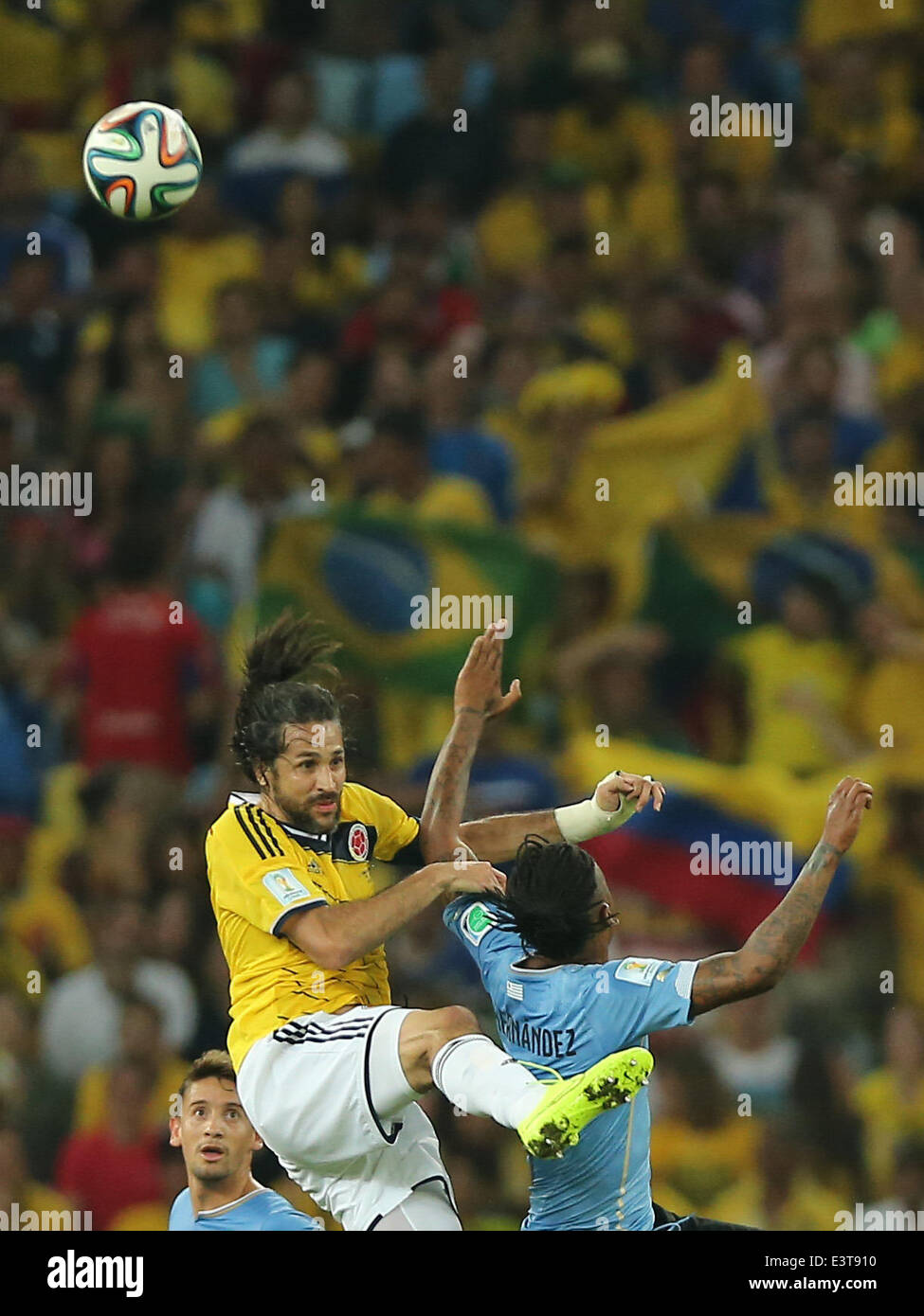 Rio De Janeiro, Brazil. 28th June, 2014. Colombia's Mario Yepes (L) jumps for the ball during a Round of 16 match between Colombia and Uruguay of 2014 FIFA World Cup at the Estadio do Maracana Stadium in Rio de Janeiro, Brazil, on June 28, 2014. Colombia won 2-0 over Uruguay on Saturday. Credit:  Xu Zijian/Xinhua/Alamy Live News Stock Photo