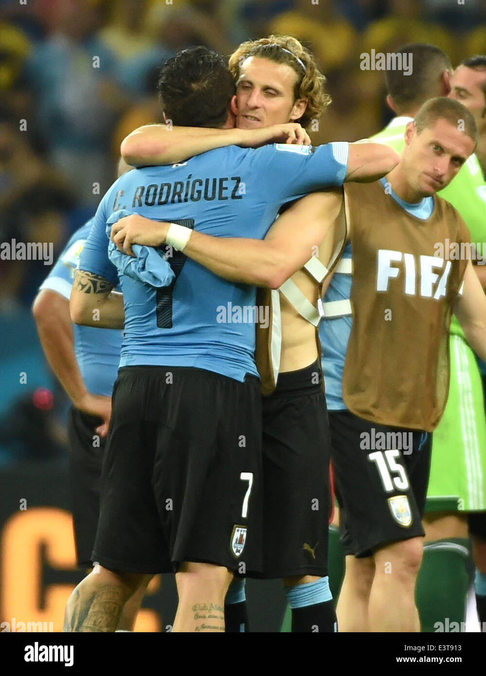 Rio De Janeiro, Brazil. 28th June, 2014. Uruguay's Cristian Rodriguez (No.7) hugs Diego Forlan after a Round of 16 match between Colombia and Uruguay of 2014 FIFA World Cup at the Estadio do Maracana Stadium in Rio de Janeiro, Brazil, on June 28, 2014. Colombia won 2-0 over Uruguay on Saturday. Credit:  Wang Yuguo/Xinhua/Alamy Live News Stock Photo