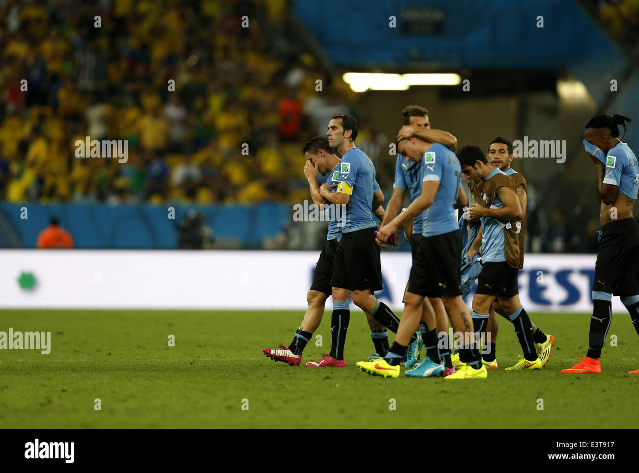 Rio De Janeiro, Brazil. 28th June, 2014. Uruguay's players leave the field after a Round of 16 match between Colombia and Uruguay of 2014 FIFA World Cup at the Estadio do Maracana Stadium in Rio de Janeiro, Brazil, on June 28, 2014. Colombia won 2-0 over Uruguay and qualified for Quarter-finals on Saturday. Credit:  Wang Lili/Xinhua/Alamy Live News Stock Photo
