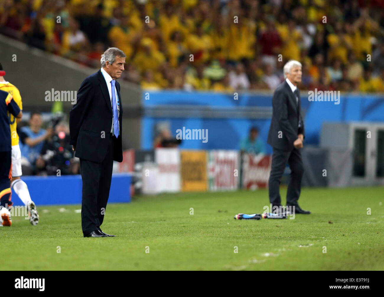Rio De Janeiro, Brazil. 28th June, 2014. Uruguay's coach Oscar Washington Tabarez (L) looks on during a Round of 16 match between Colombia and Uruguay of 2014 FIFA World Cup at the Estadio do Maracana Stadium in Rio de Janeiro, Brazil, on June 28, 2014. Colombia won 2-0 over Uruguay and qualified for Quarter-finals on Saturday. Credit:  Wang Lili/Xinhua/Alamy Live News Stock Photo