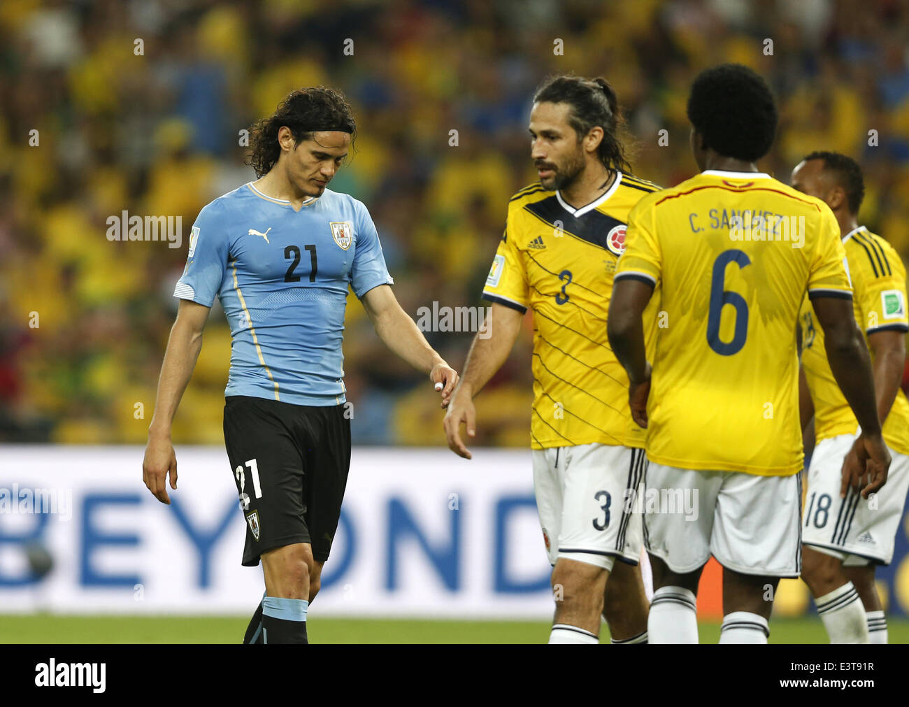 Rio De Janeiro, Brazil. 28th June, 2014. Uruguay's Edinson Cavani (L) reacts during a Round of 16 match between Colombia and Uruguay of 2014 FIFA World Cup at the Estadio do Maracana Stadium in Rio de Janeiro, Brazil, on June 28, 2014. Colombia won 2-0 over Uruguay and qualified for Quarter-finals on Saturday. Credit:  Wang Lili/Xinhua/Alamy Live News Stock Photo