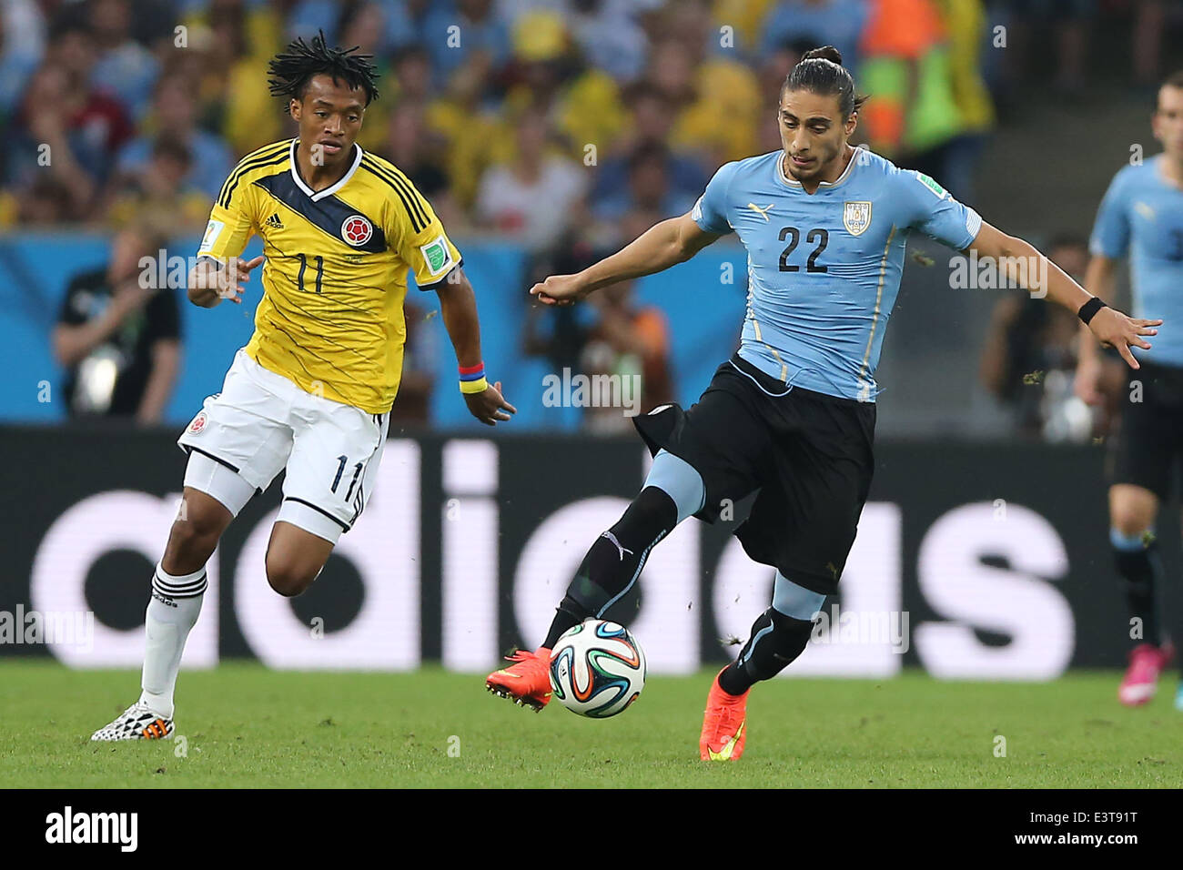 Rio De Janeiro, Brazil. 28th June, 2014. Uruguay's Martin Caceres controls the ball during a Round of 16 match between Colombia and Uruguay of 2014 FIFA World Cup at the Estadio do Maracana Stadium in Rio de Janeiro, Brazil, on June 28, 2014. Colombia won 2-0 over Uruguay on Saturday. Credit:  Wang Yuguo/Xinhua/Alamy Live News Stock Photo