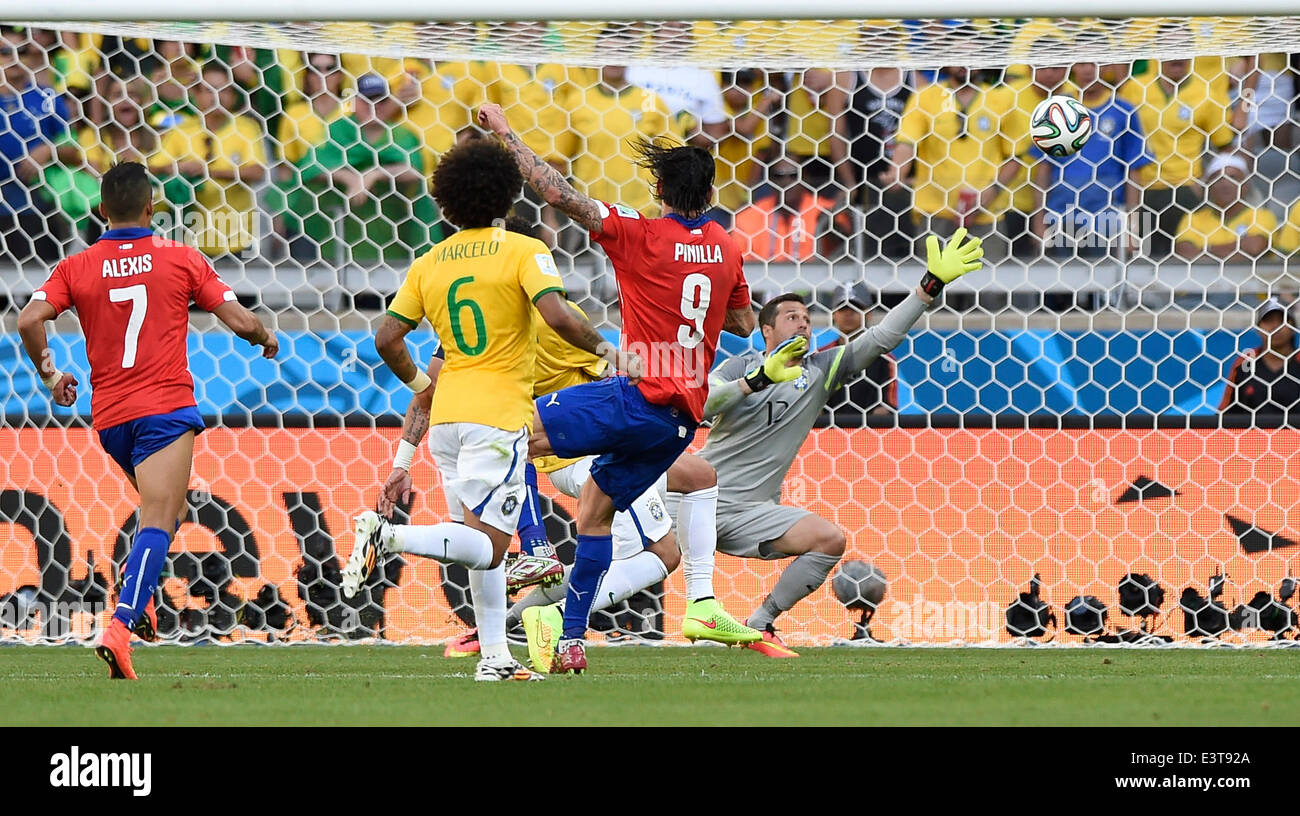 Belo Horizonte, Brazil. 28th June, 2014. Chile's Mauricio Pinilla (R, front) shoots the ball during a Round of 16 match between Brazil and Chile of 2014 FIFA World Cup at the Estadio Mineirao Stadium in Belo Horizonte, Brazil, on June 28, 2014. Brazil won 4-3 (3-2 in penalties) over Chile and qualified for Quarter-finals on Saturday. Credit:  Qi Heng/Xinhua/Alamy Live News Stock Photo