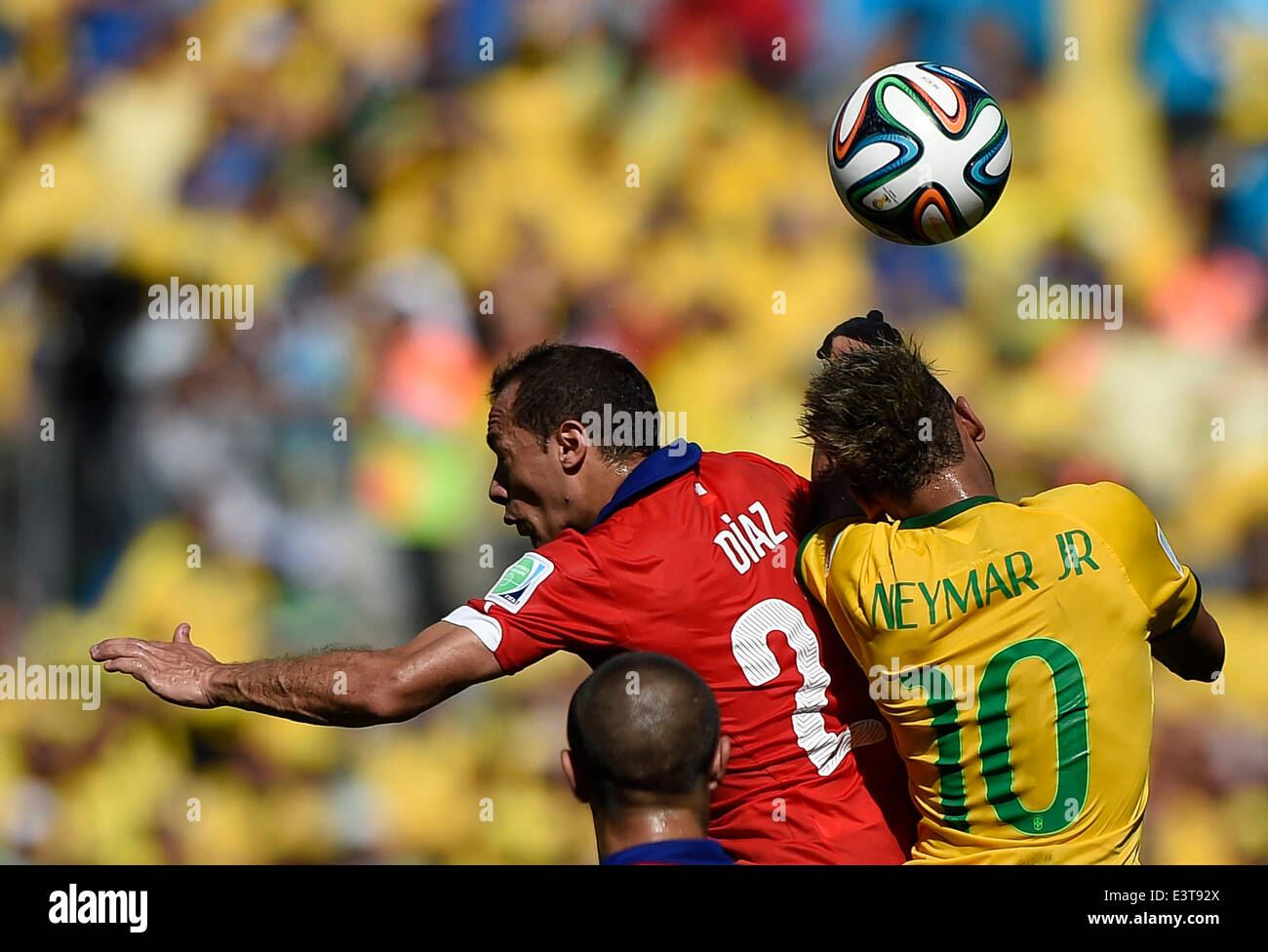 Belo Horizonte, Brazil. 28th June, 2014. Brazil's Neymar (R) vies with Chile's Marcelo Diaz during a Round of 16 match between Brazil and Chile of 2014 FIFA World Cup at the Estadio Mineirao Stadium in Belo Horizonte, Brazil, on June 28, 2014. Brazil won 4-3 (3-2 in penalties) over Chile and qualified for Quarter-finals on Saturday. Credit:  Qi Heng/Xinhua/Alamy Live News Stock Photo