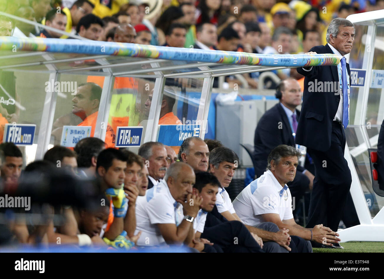 Rio De Janeiro, Brazil. 28th June, 2014. Uruguay's coach Oscar Washington Tabarez (1st R) looks on during a Round of 16 match between Colombia and Uruguay of 2014 FIFA World Cup at the Estadio do Maracana Stadium in Rio de Janeiro, Brazil, on June 28, 2014. Colombia won 2-0 over Uruguay and qualified for Quarter-finals on Saturday. Credit:  Wang Lili/Xinhua/Alamy Live News Stock Photo