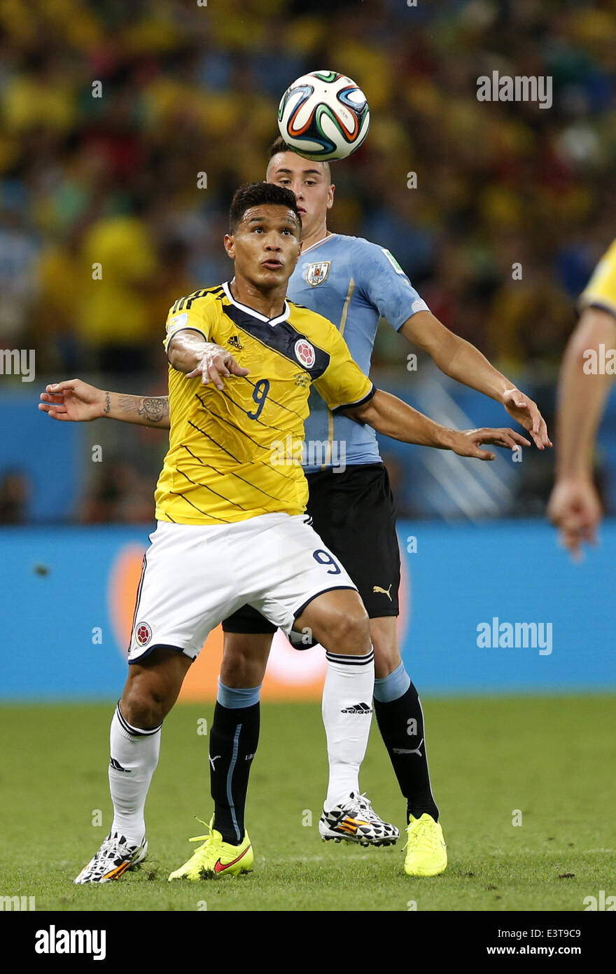 Rio De Janeiro, Brazil. 28th June, 2014. Colombia's Teofilo Gutierrez (front) competes during a Round of 16 match between Colombia and Uruguay of 2014 FIFA World Cup at the Estadio do Maracana Stadium in Rio de Janeiro, Brazil, on June 28, 2014. Colombia won 2-0 over Uruguay and qualified for Quarter-finals on Saturday. Credit:  Wang Lili/Xinhua/Alamy Live News Stock Photo