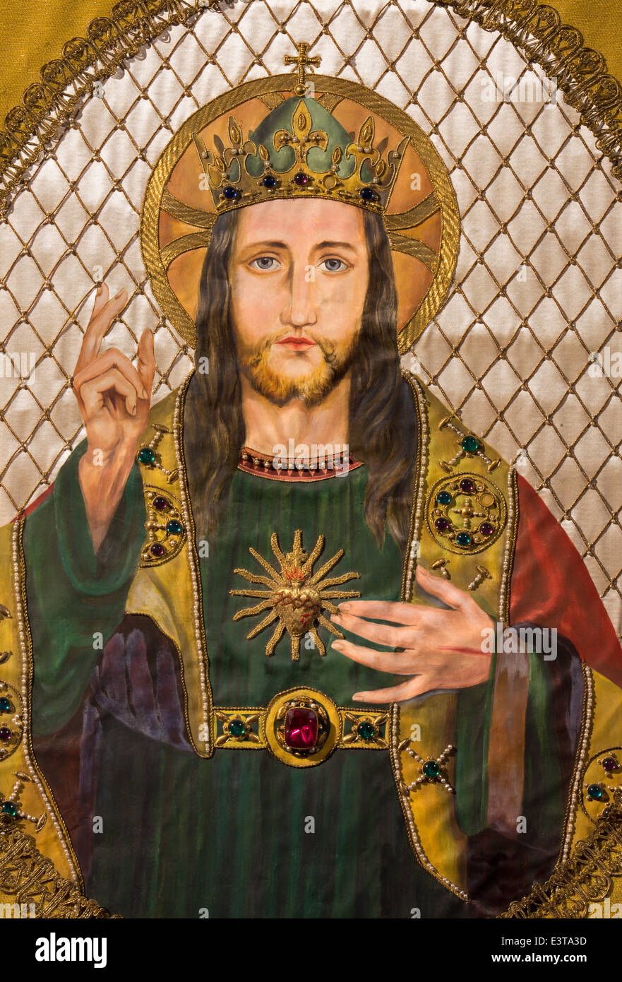 Brussels - Needelwork of Jesus Christ heart on the old catholic vestment in St. Jacques Church at The Coudenberg. Stock Photo