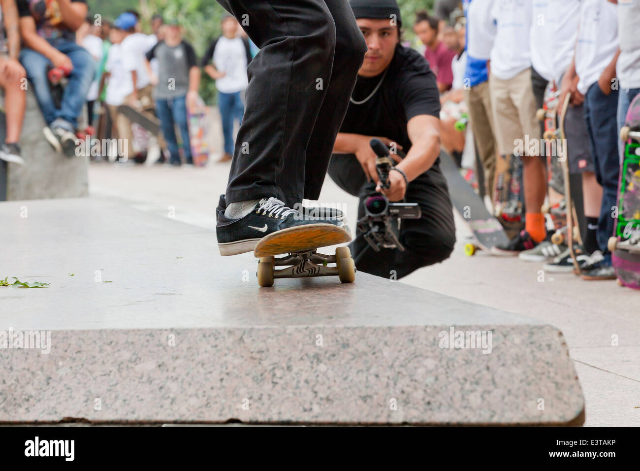 Street skateboarder approaching jump - USA Stock Photo
