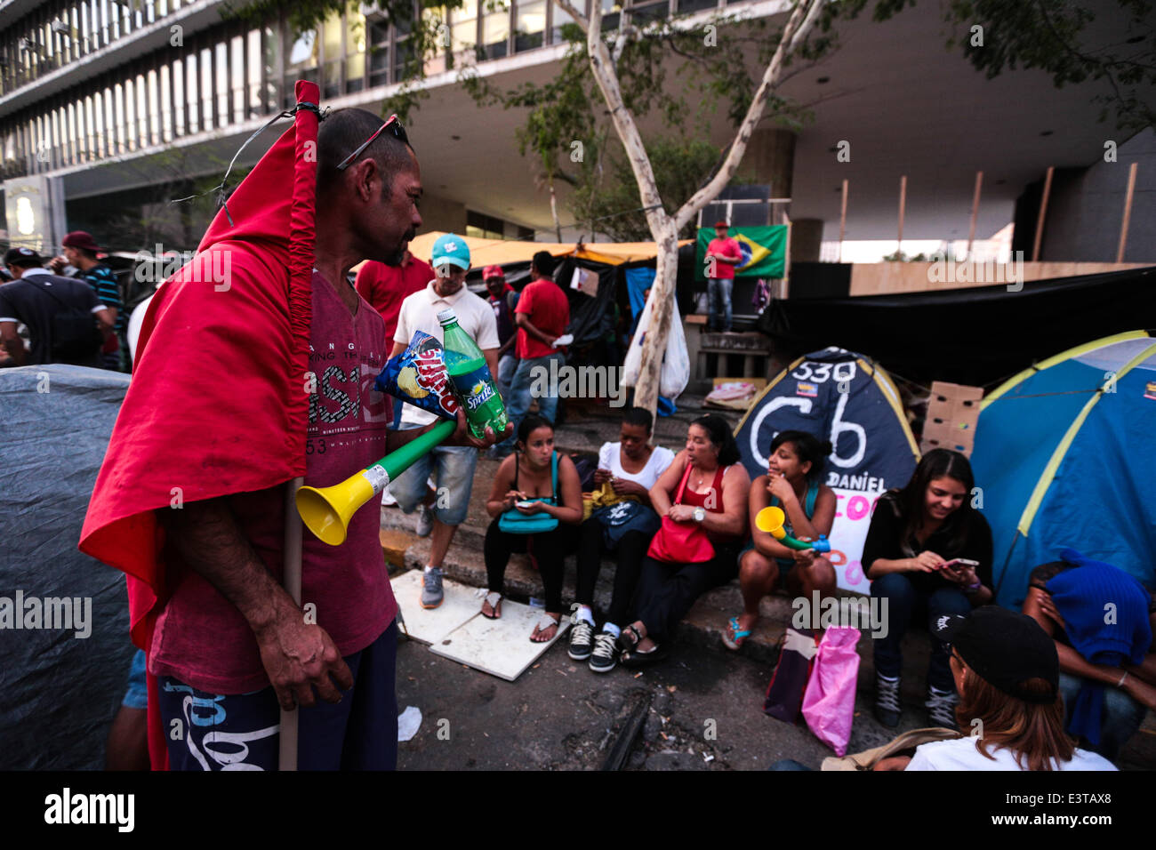 Members of the Homeless Workers Movement (MTST) protest in front of the City Council of Sao Paulo in Sao Paulo, Brazil. Protesters try to pressure the councilors to vote for the 'Director Plan' of the city and for the approval of the bill that regulates the People's Cup occupation, located in the Itaquera neighborhood and other occupations. Councilors end up not doing the voting on June 27, which was postponed to June 30. Many protesters, including some families are camped in front of the City Council since June 24 and intend to stay there until June 30 when the voting is scheduled to occur. ( Stock Photo