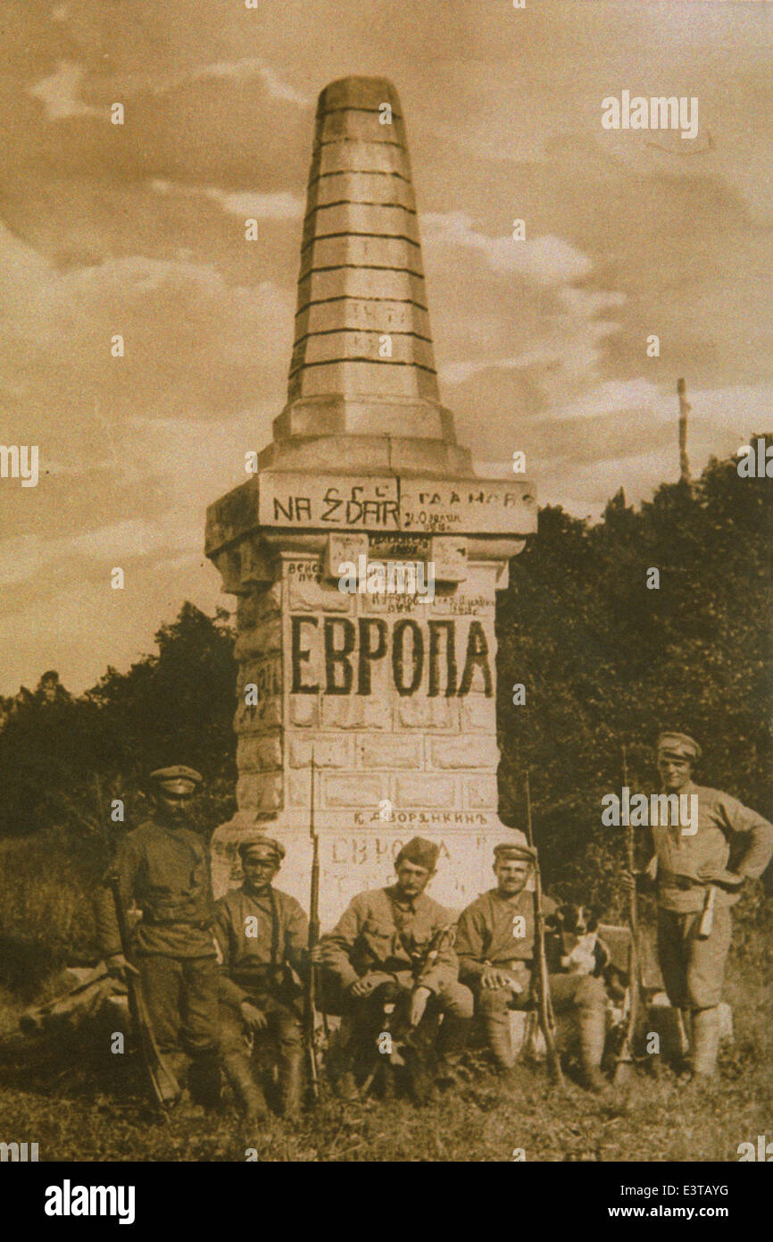 Czechoslovak soldiers pose next to the obelisk on the border between Europe and Asia in the Urals Mountains, Russia. Stock Photo