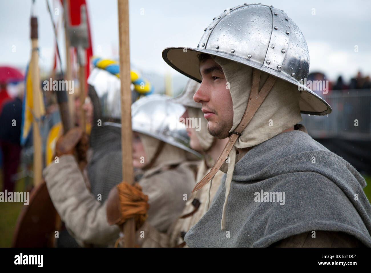 Stirling, UK. 28th June, 2014.  Pike men at the Battle of Bannockburn re-enactment. Thousands of people have turned out for a weekend of re-enactments and historical recreations.  The Battle was a Scottish victory in the First War of Scottish Independence.  Stirling Castle, a Scots royal fortress, occupied by the English, was under siege by the Scottish army. Edward II of England assembled a force to relieve it which failed, and his army was defeated in battle by a smaller army commanded by Robert the Bruce of Scotland. Stock Photo